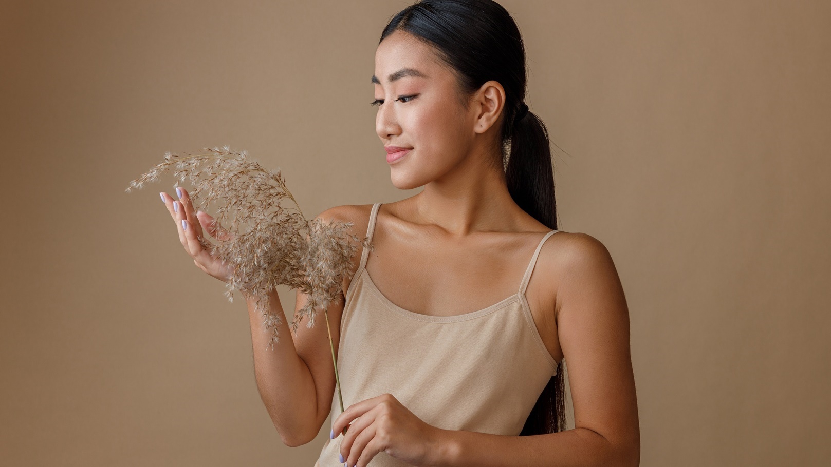 asian-young-woman-with-cereal-grass-standing-in-st-2022-09-07-20-59-38-utc
