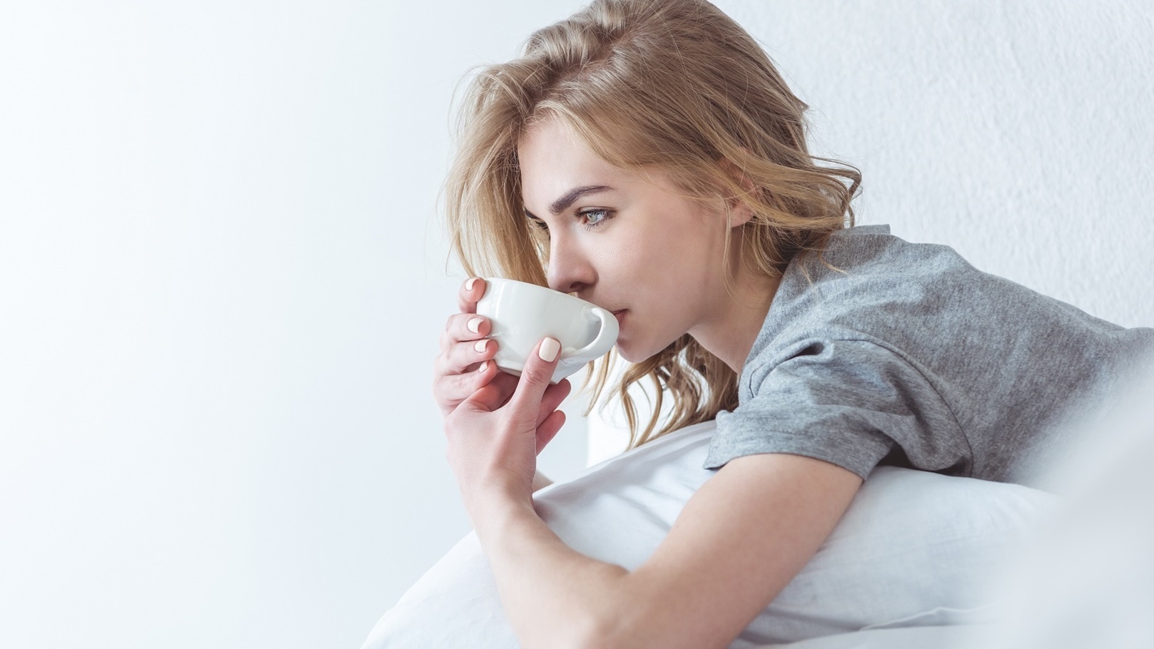 beautiful-pensive-woman-drinking-coffee-and-relaxi-2022-04-20-14-28-58-utc (1)