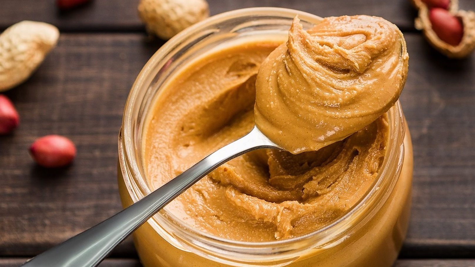 peanut-butter-in-jar-and-spoon-shutterstock_1419694937