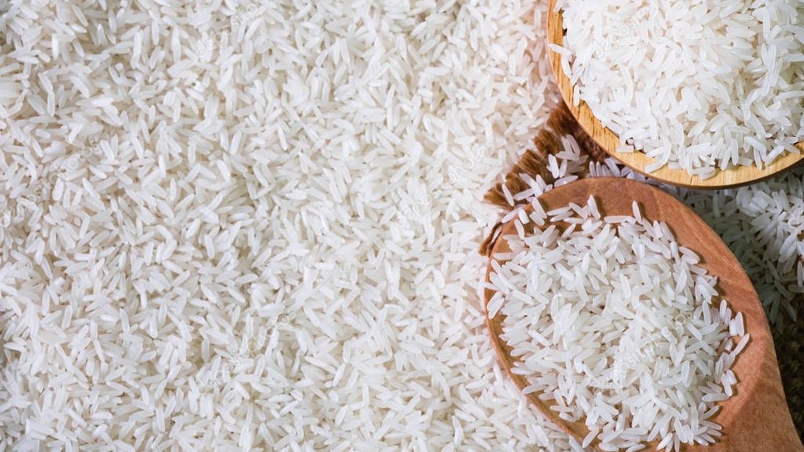 depositphotos_337779704-stock-photo-white-rice-seed-brown-wooden