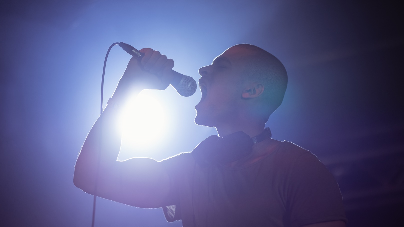 cheerful-male-singer-performing-at-nightclub-2021-08-28-16-44-32-utc