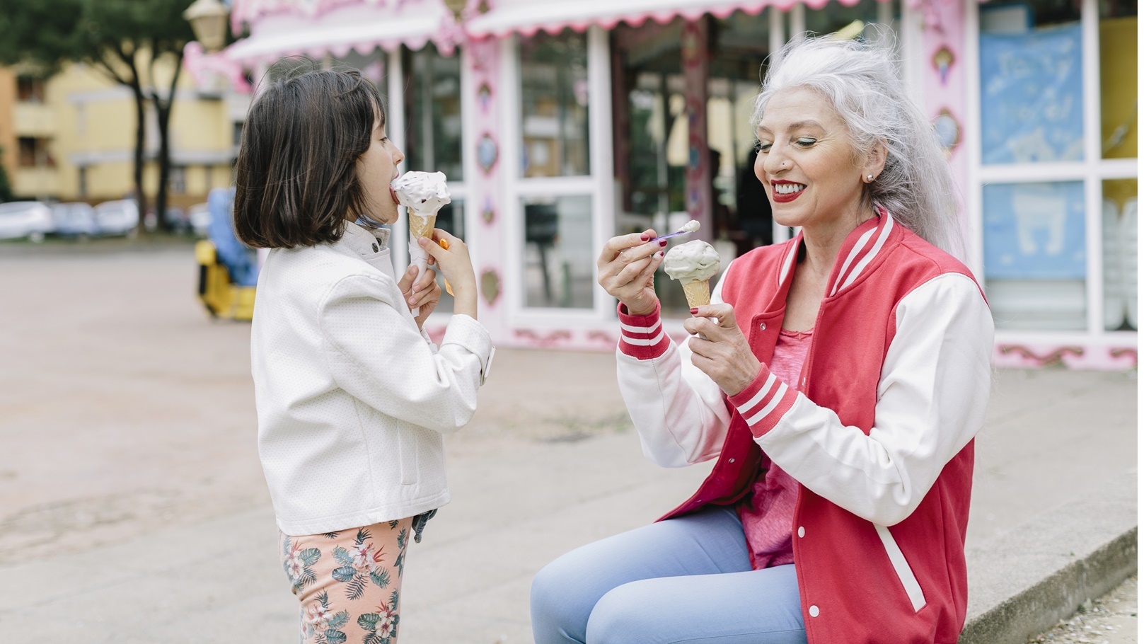 mature-woman-and-girl-eating-ice-cream-cones-outsi-2021-11-17-01-09-34-utc