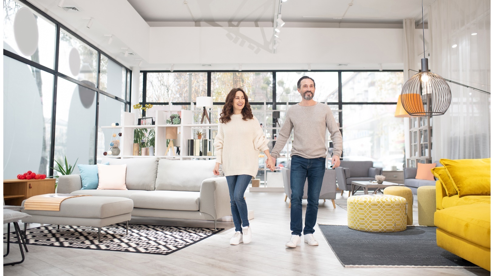 two-people-looking-at-furniture-models-in-a-modern-2021-09-04-03-08-07-utc