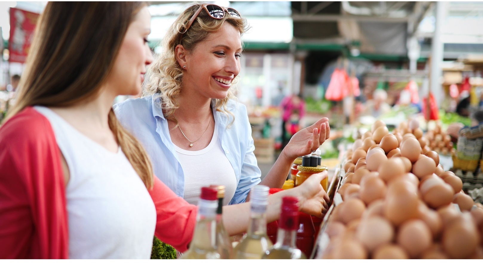 women-shopping-fresh-eggs-at-local-farmer-market-2021-08-26-17-35-20-utc