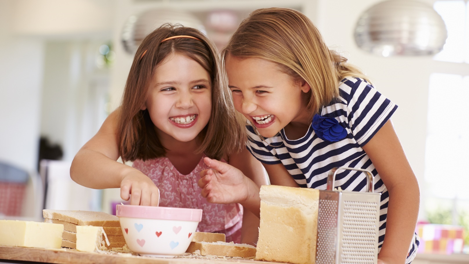 girls-eating-ingredients-whilst-making-cheese-on-t-2021-08-26-16-12-45-utc