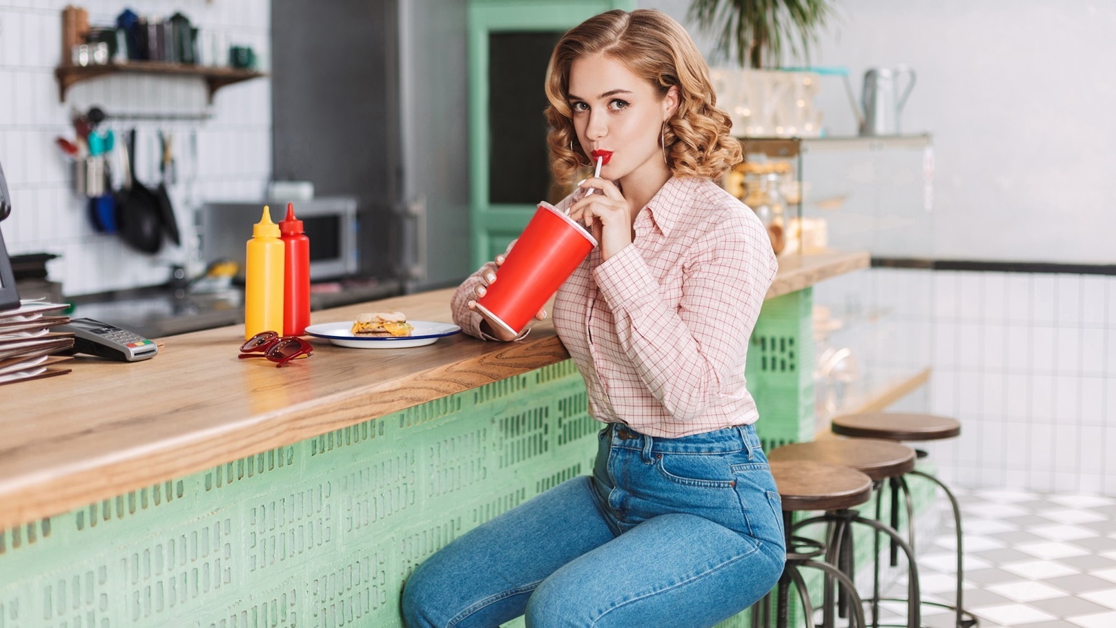 pretty-girl-in-jeans-sitting-at-the-bar-counter-in-2021-08-27-09-21-56-utc