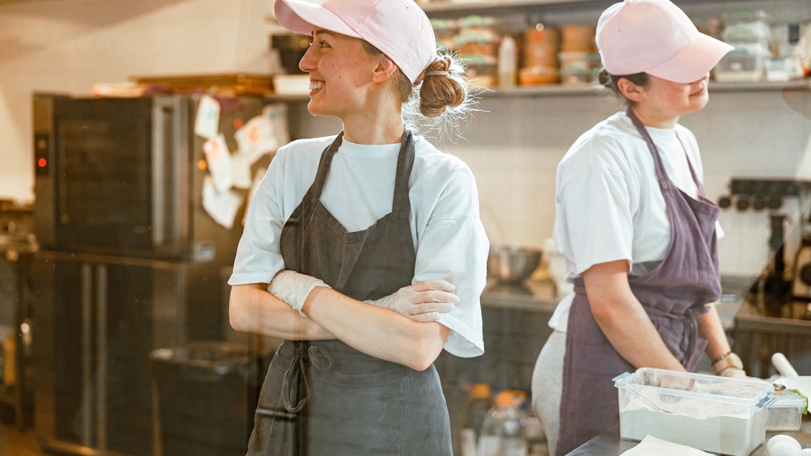 cheerful-woman-with-colleague-stand-at-table-with-2021-10-26-01-48-41-utc