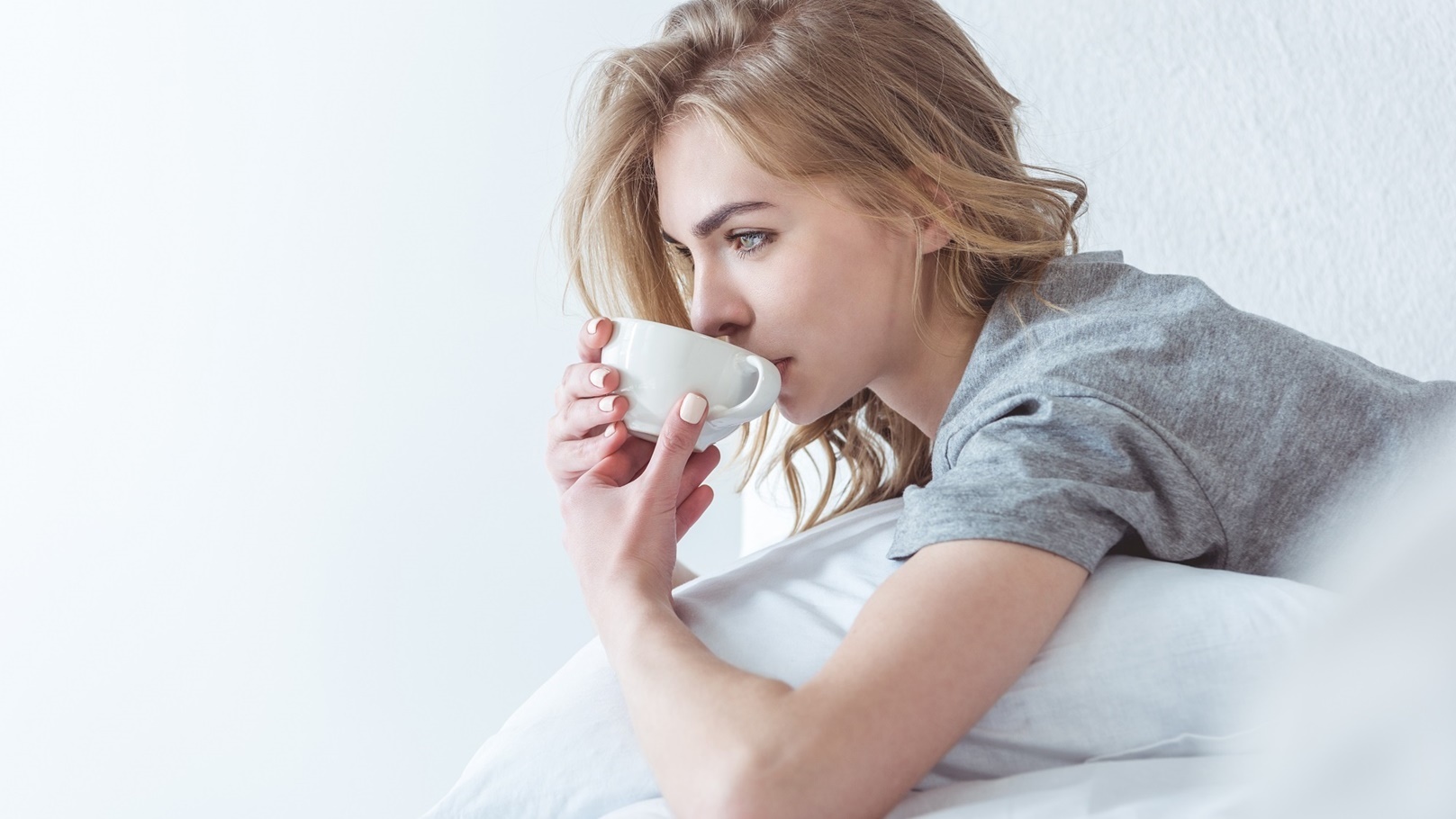 beautiful-pensive-woman-drinking-coffee-and-relaxi-2022-04-20-14-28-58-utc (1)