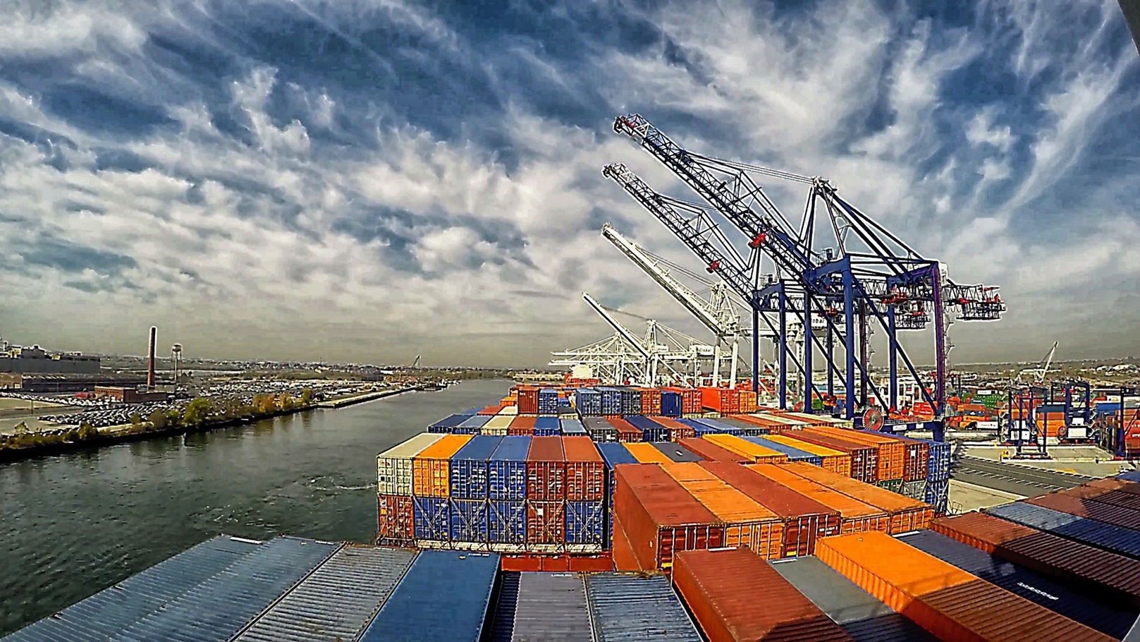 containers-on-cranes-in-export-terminal-port-2022-03-21-12-37-56-utc