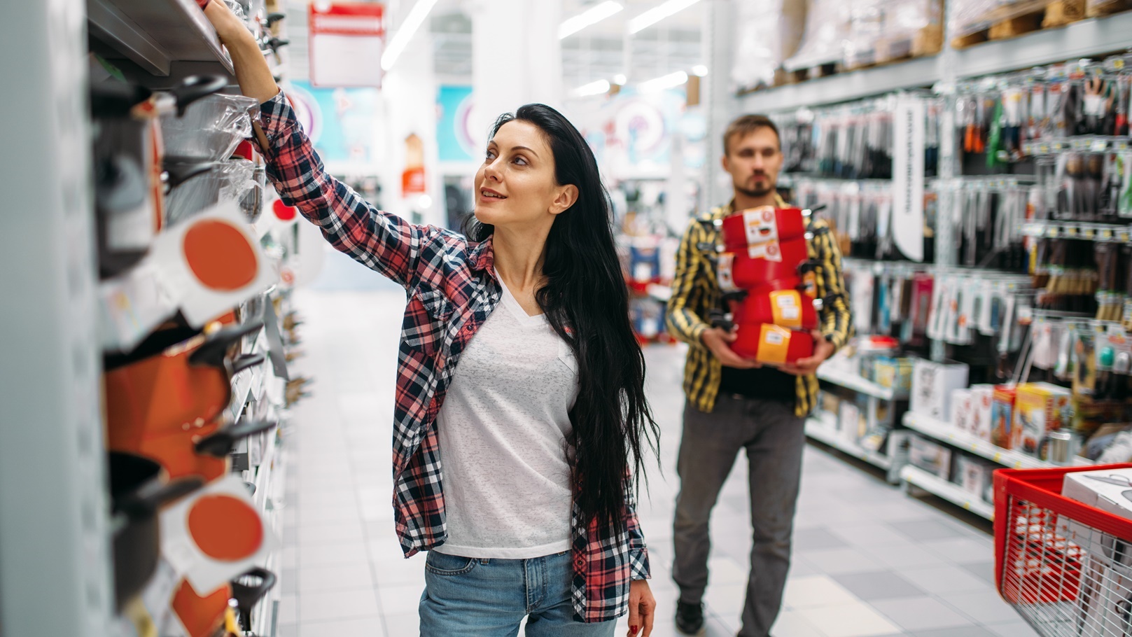 young-couple-buying-pans-in-supermarket-2021-08-26-16-27-03-utc