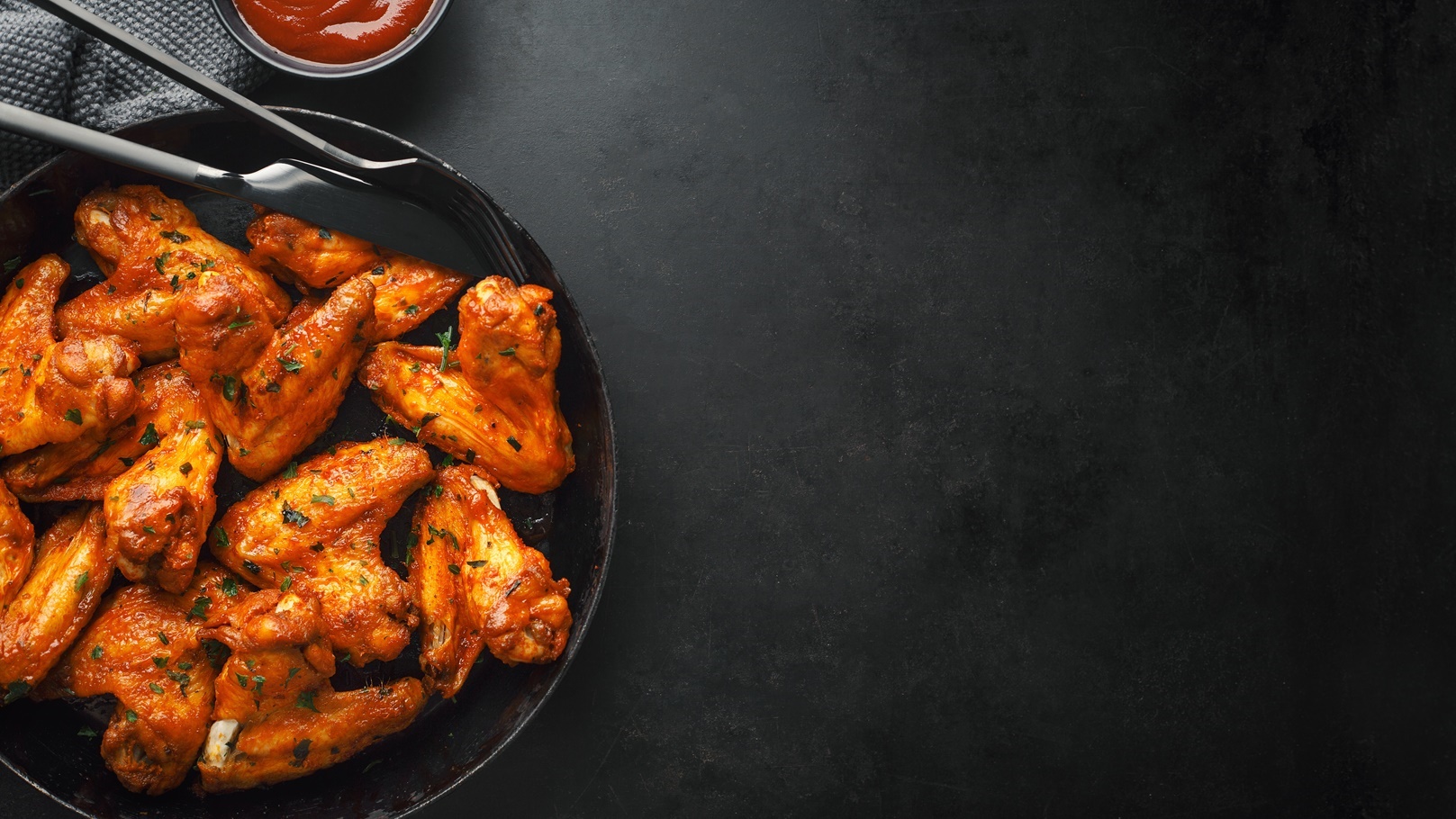 chicken-wings-grilled-in-sauce-on-pan-2021-08-26-18-55-18-utc