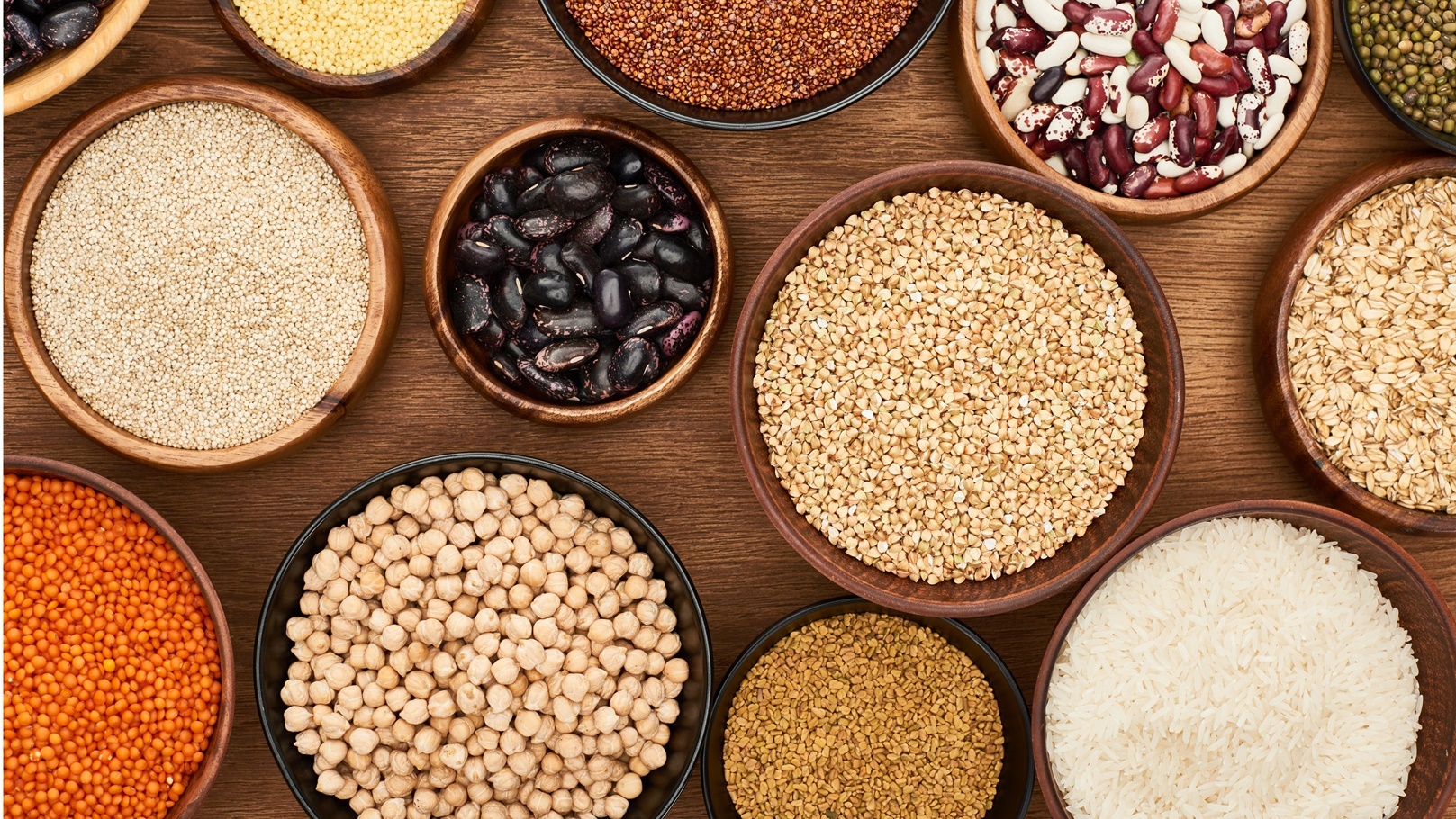 top-view-of-bowls-with-whole-grains-and-legumes-on-2021-08-30-19-51-25-utc