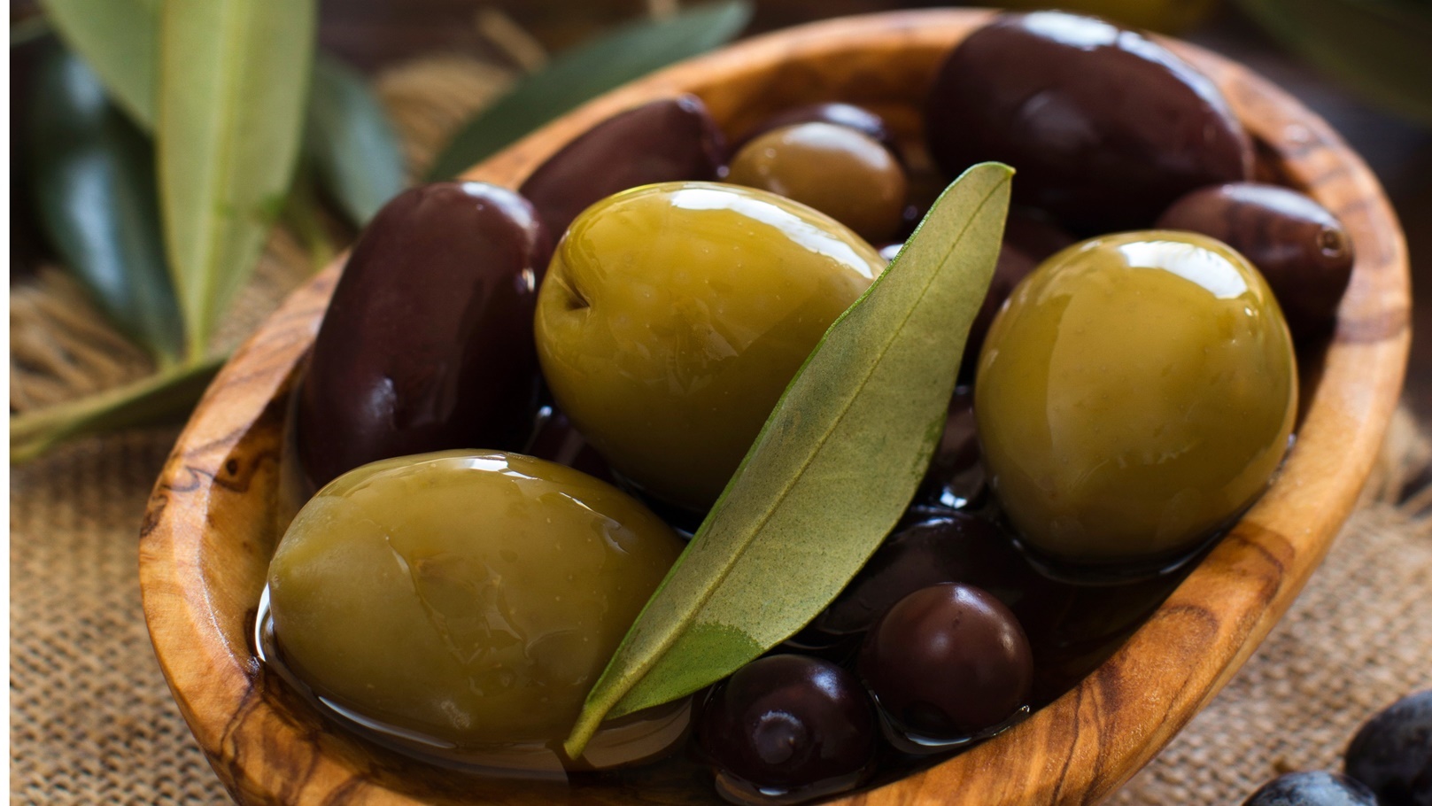 olive-oil-and-olives-on-wood-background-2021-08-26-15-46-24-utc