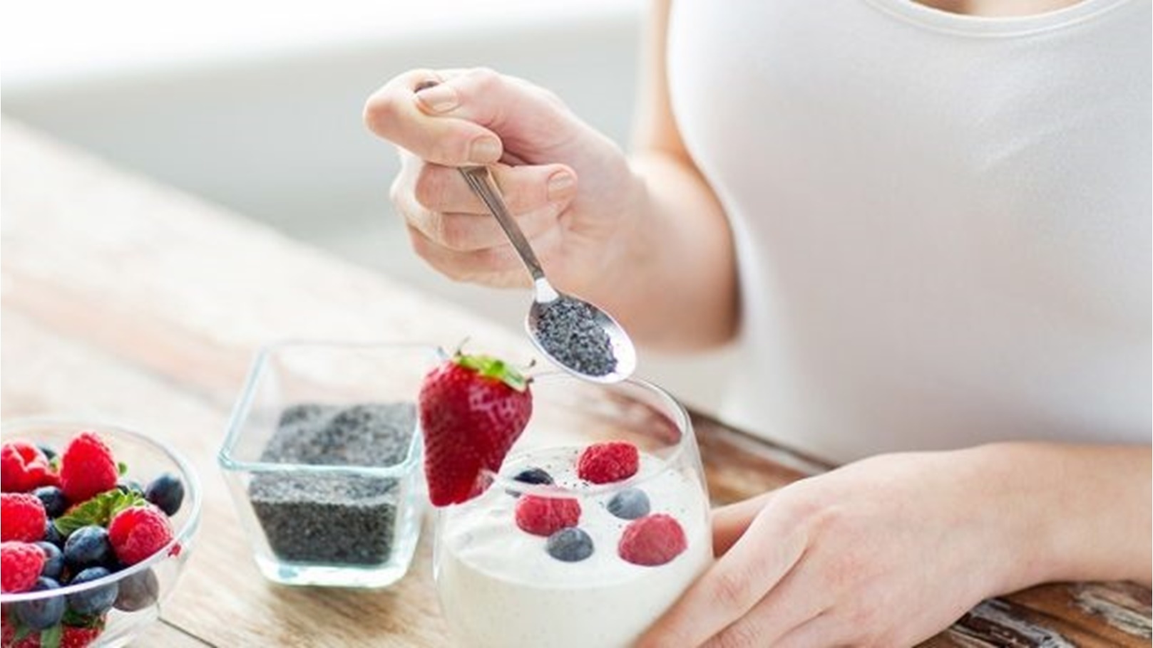 woman-eating-yogurt-with-chia-seeds