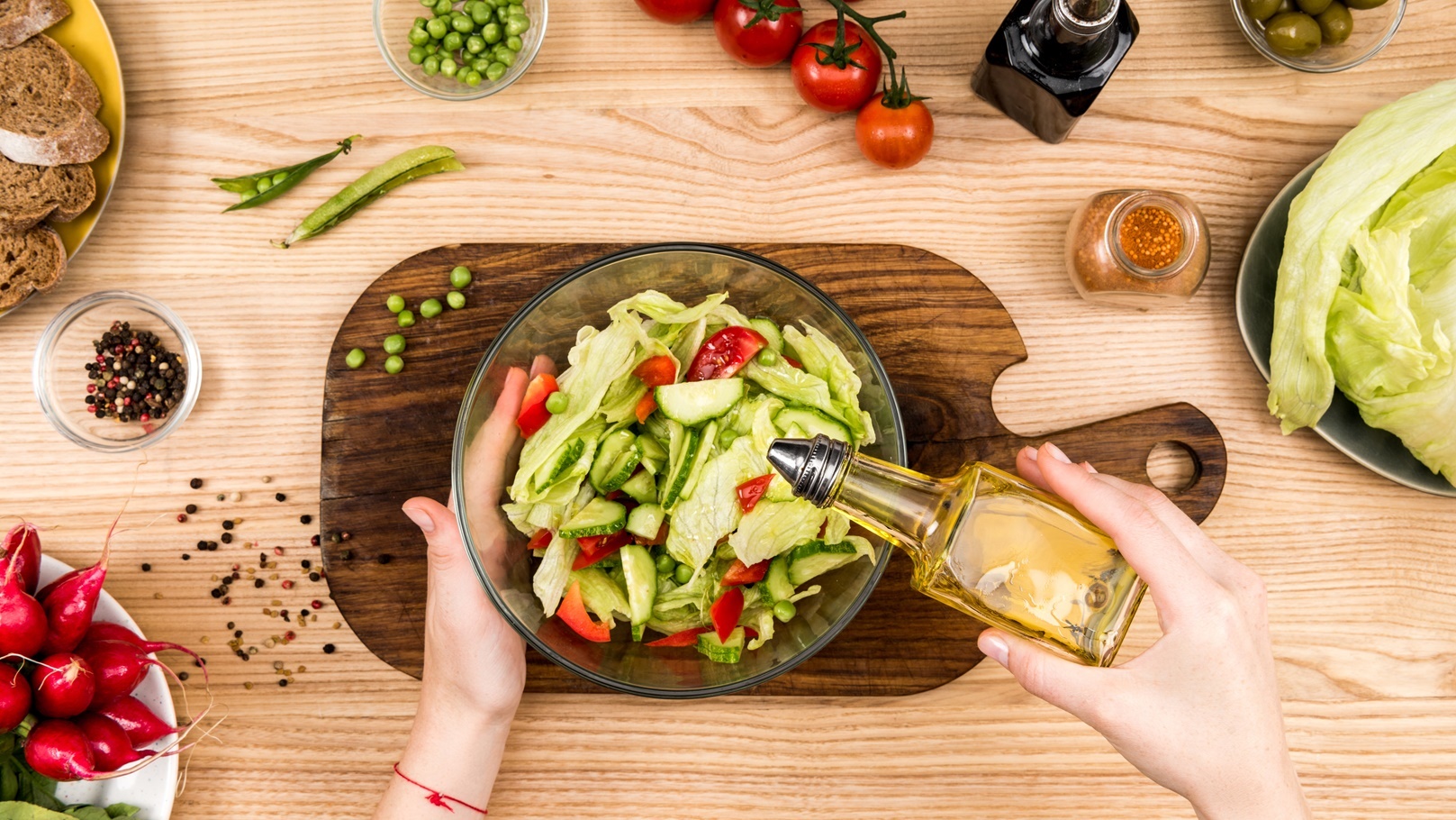 cropped-sot-of-woman-pouring-olive-oil-onto-fresh-2021-08-29-11-18-15-utc