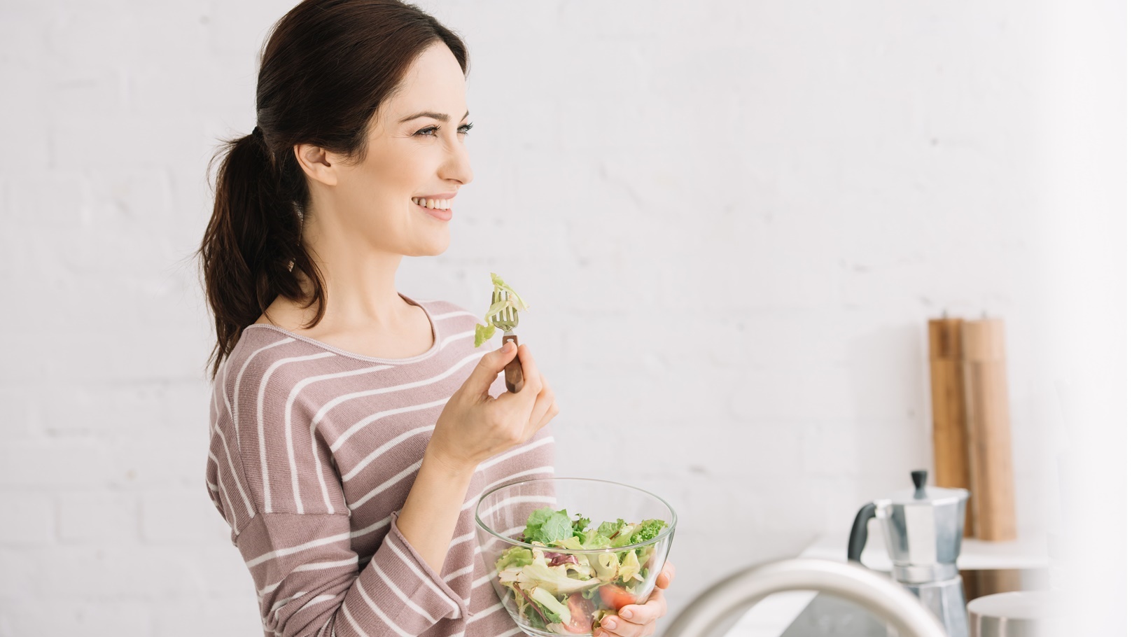 young-cheerful-woman-looking-away-while-eating-ve-2021-09-03-01-46-54-utc