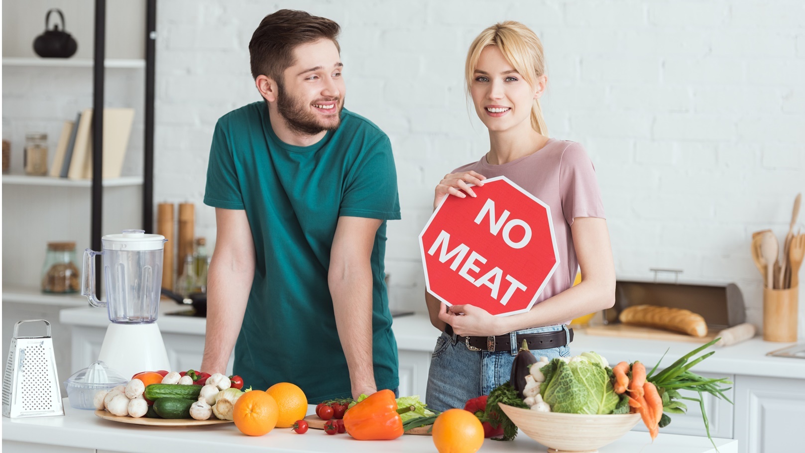 couple-of-vegans-standing-with-no-meat-sign-at-kit-2021-10-07-18-45-27-utc