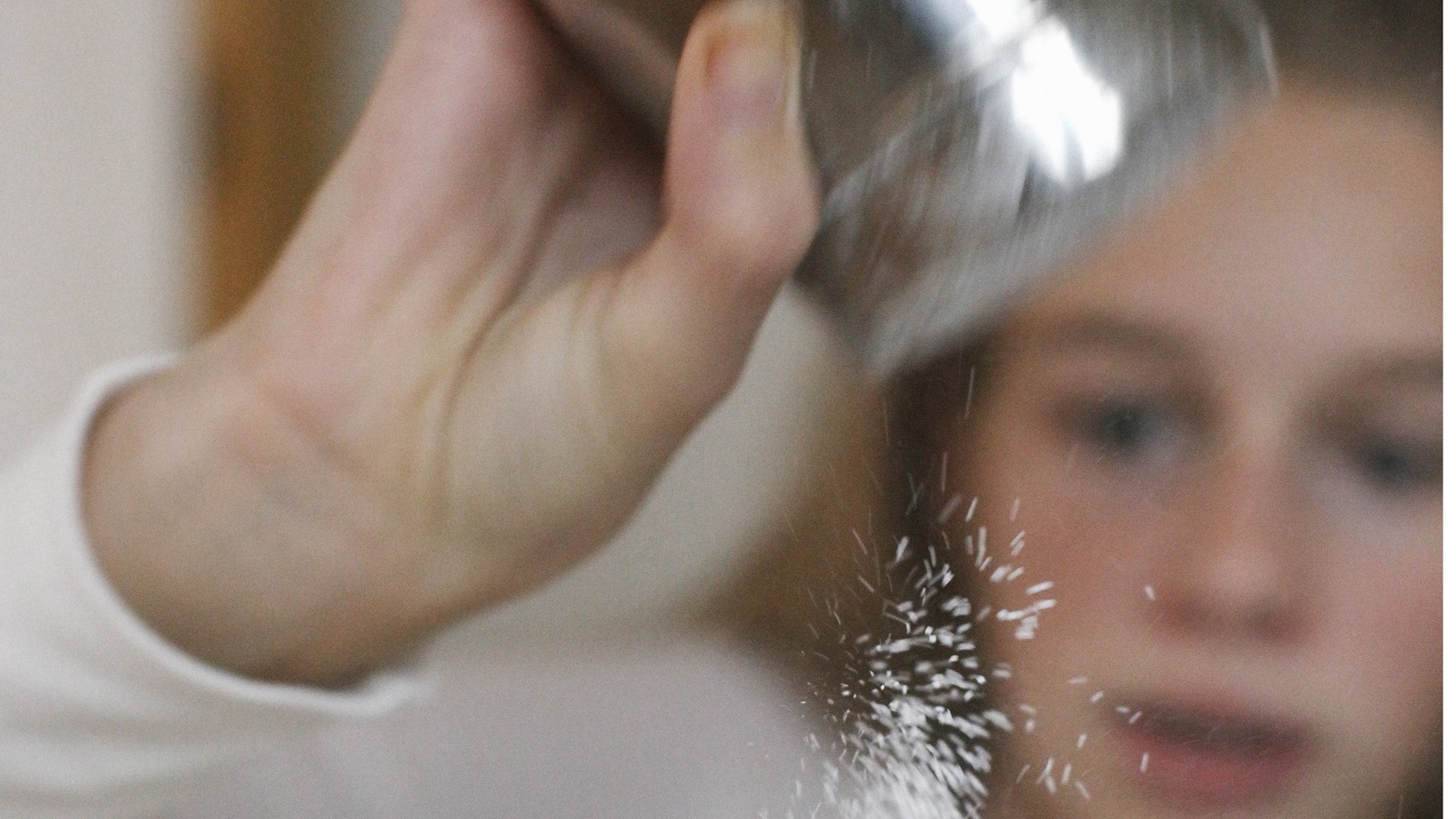 a-girl-dredging-marshmallows-with-icing-sugar-from-2022-03-04-02-39-52-utc