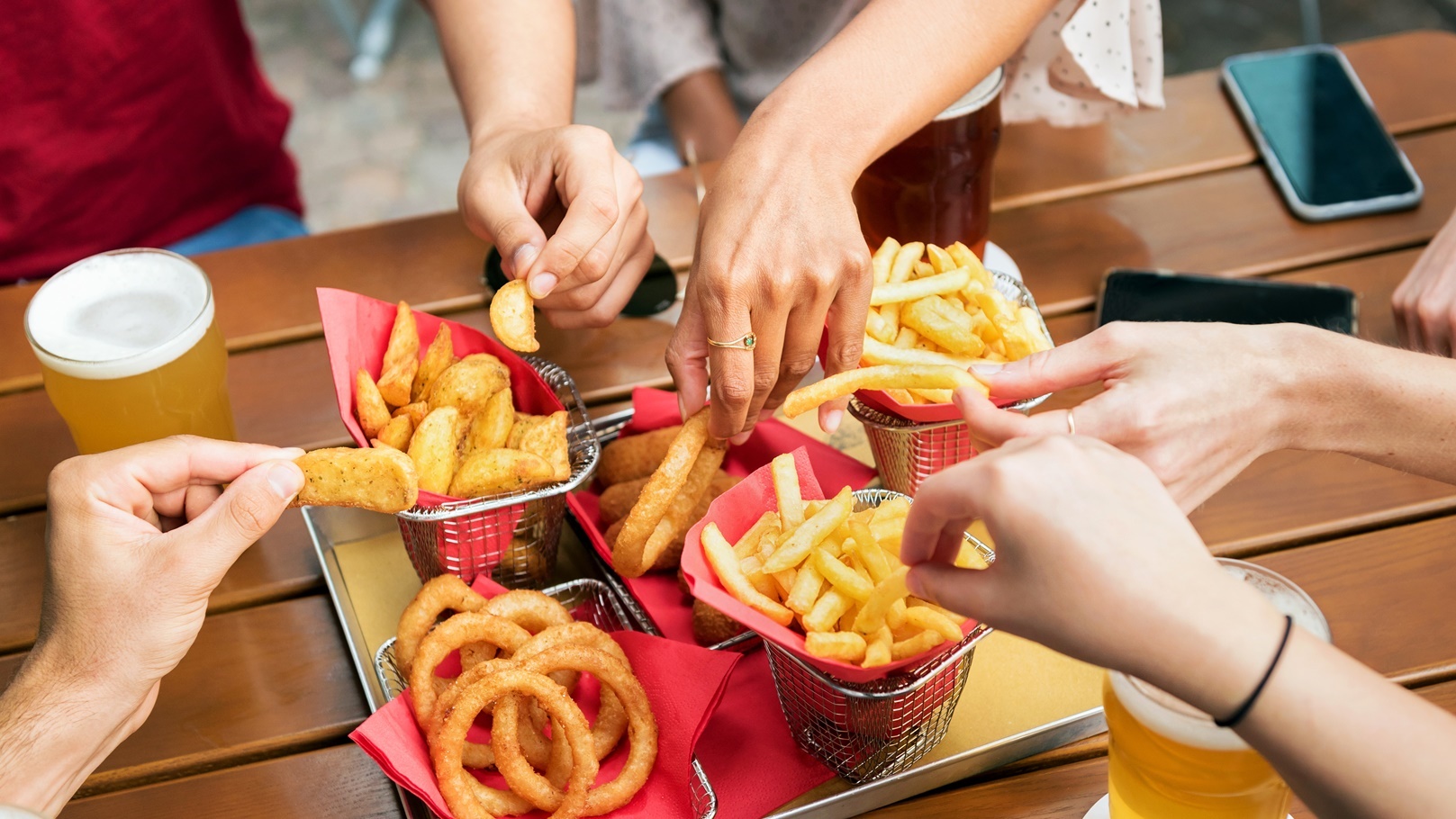 friends-eating-fries-in-pub-2021-10-05-18-15-24-utc
