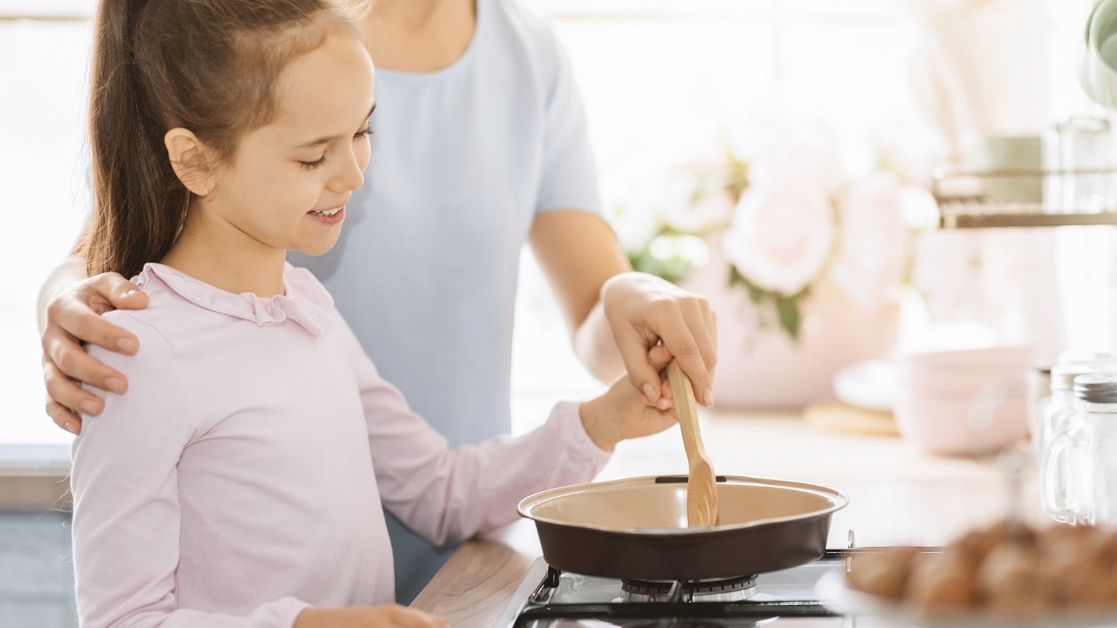 cute-little-girl-cooking-together-with-mom-2021-08-26-16-34-00-utc