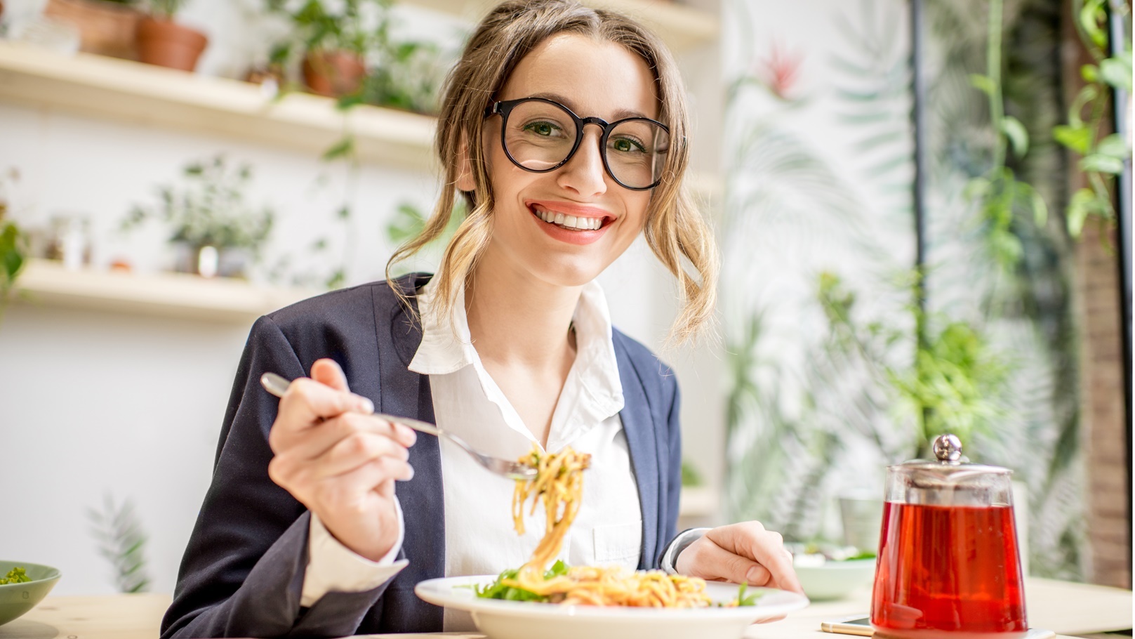 businesswoman-eating-pasta-at-the-restaurant-2021-12-23-15-34-37-utc