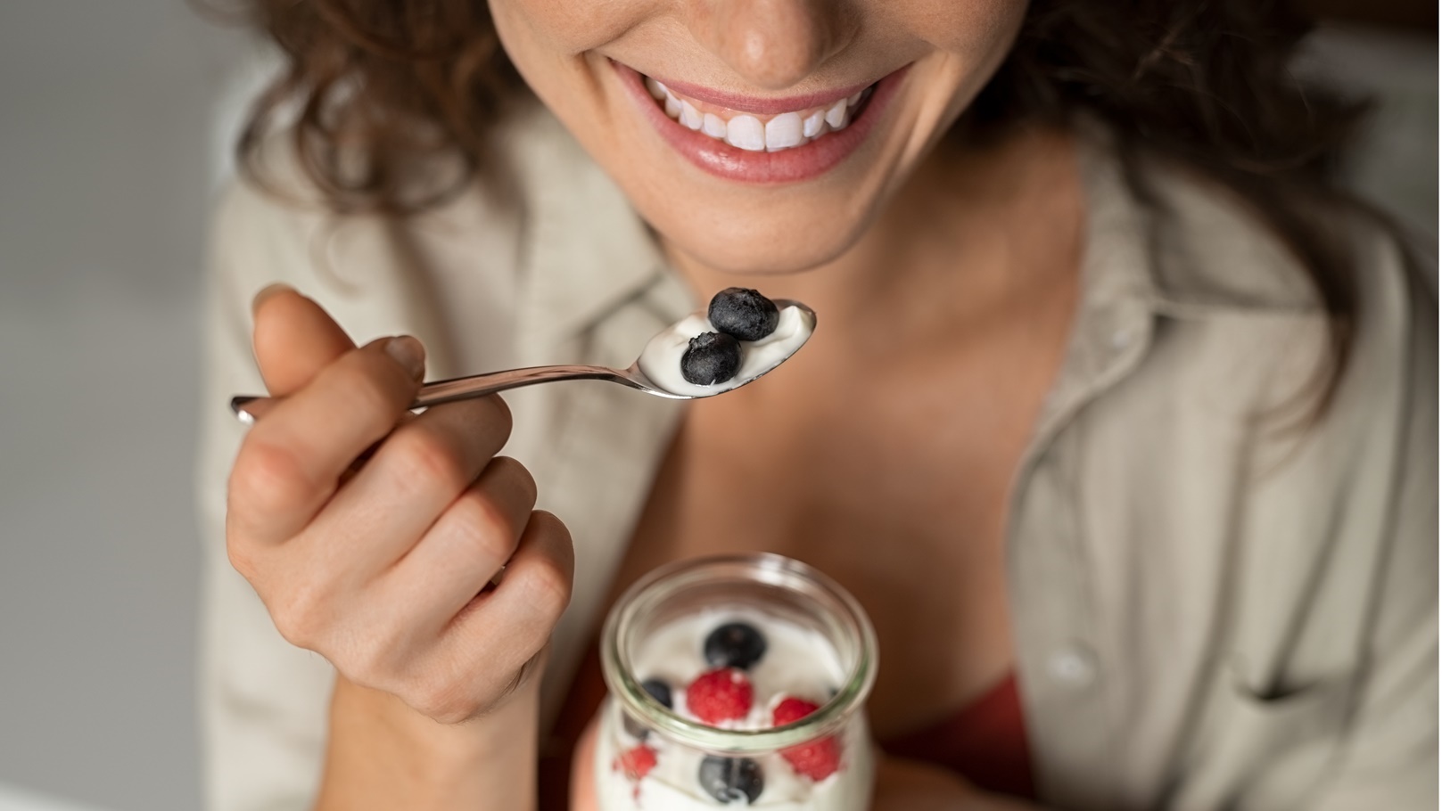 close-up-of-woman-eating-berries-and-yogurt-2021-08-29-23-41-24-utc