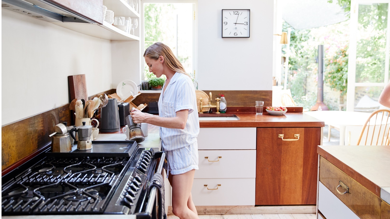 woman-wearing-pajamas-at-home-in-kitchen-making-fr-2022-02-08-22-39-27-utc