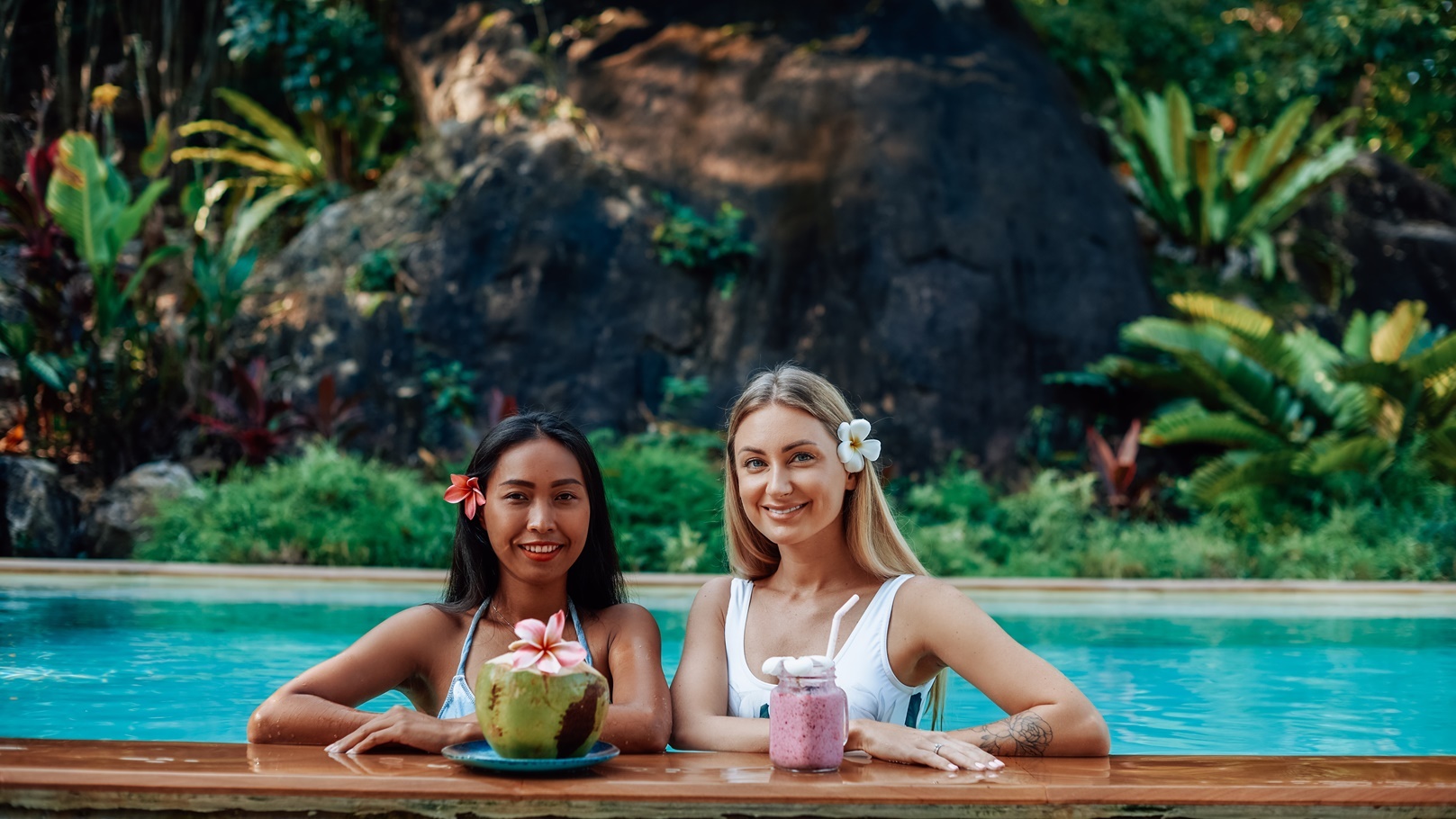 caucasian-female-traveller-with-asian-woman-in-poo-2021-08-31-09-41-47-utc