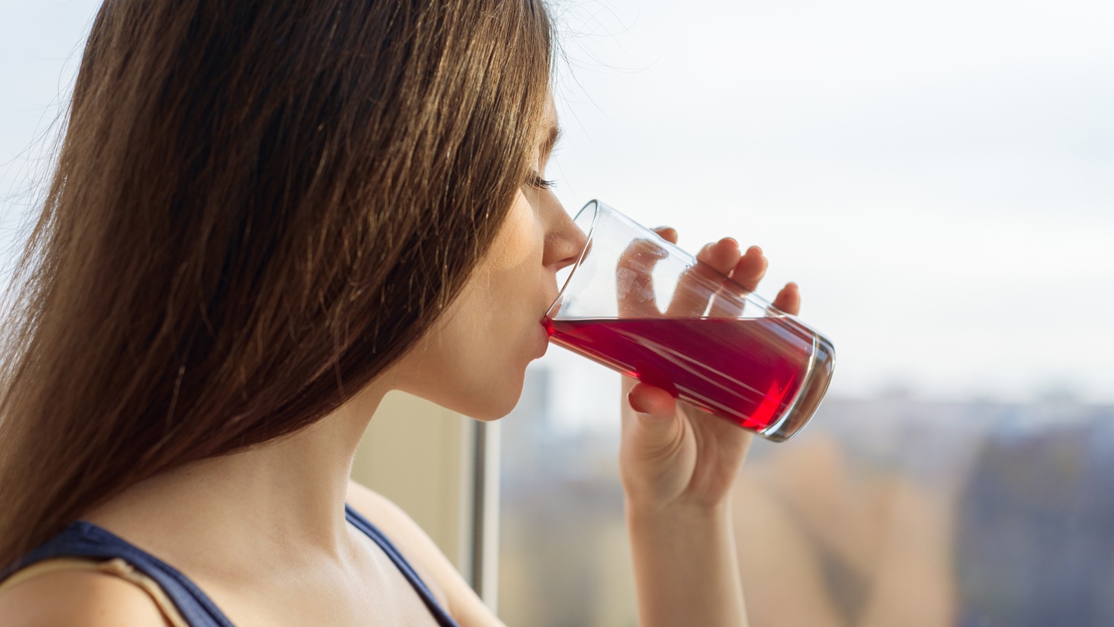 young-woman-drinking-natural-fresh-berry-juice-fro-2022-01-26-07-52-59-utc (1)