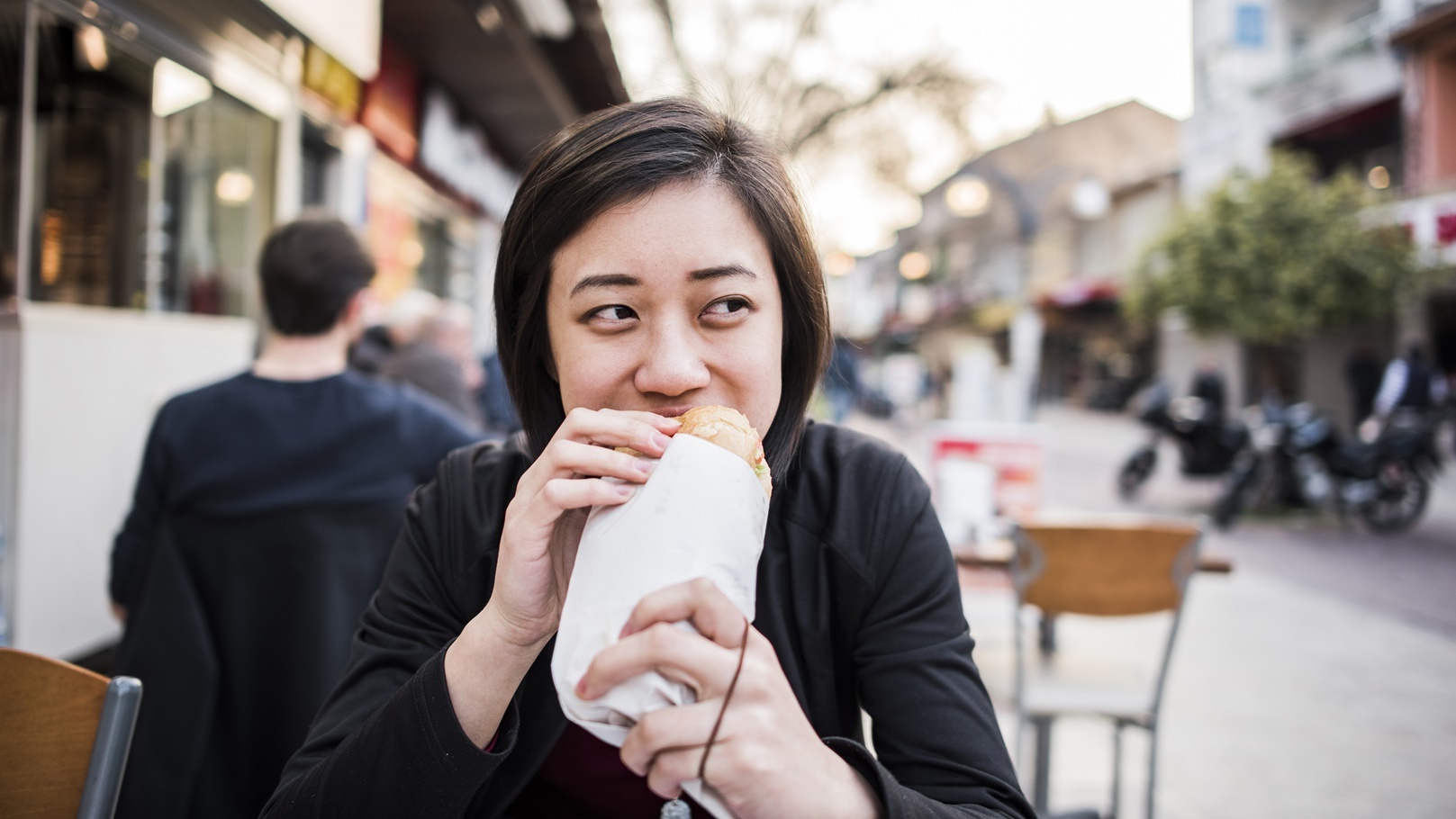 woman-eating-kebab-bread-at-cafe-kusadasi-izmir-2022-03-07-23-51-44-utc