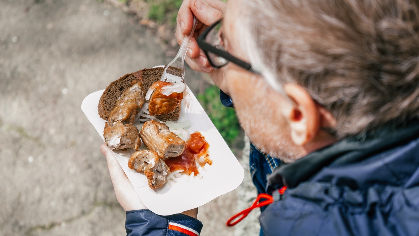 a-man-in-the-park-outdoors-is-resting-and-eating-a-2021-09-03-04-10-44-utc