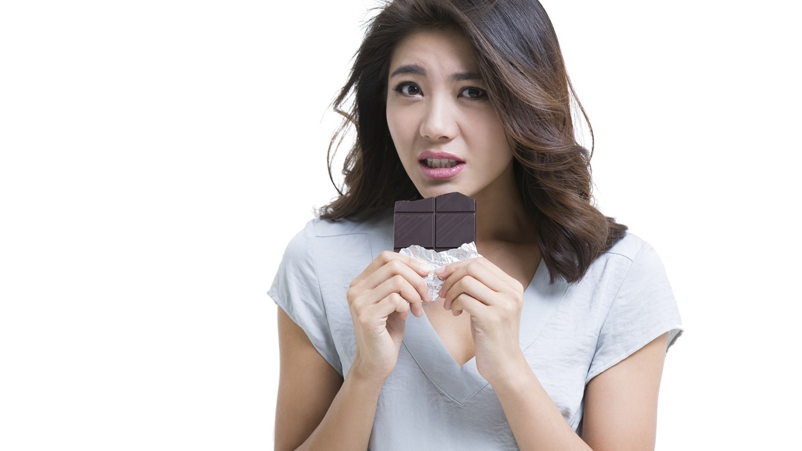 young-woman-eating-chocolate-2022-03-29-08-41-38-utc