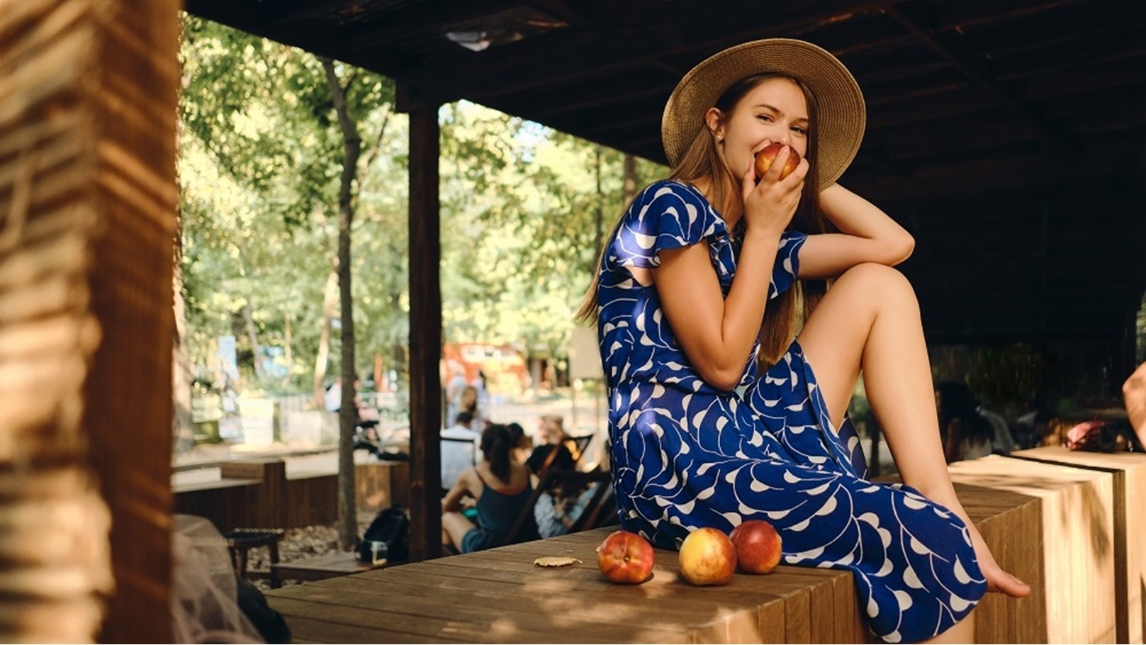 young-pretty-woman-in-dress-and-hat-barefoot-eatin-2021-08-26-18-52-15-utc