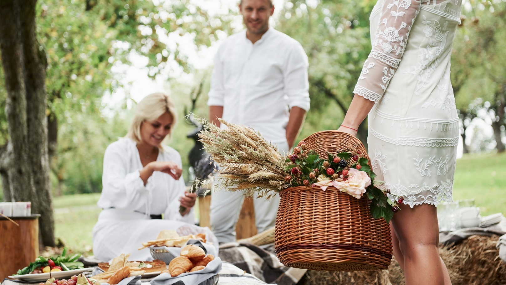 three-friends-near-the-table-with-food-outdoors-g-2021-08-29-19-24-36-utc