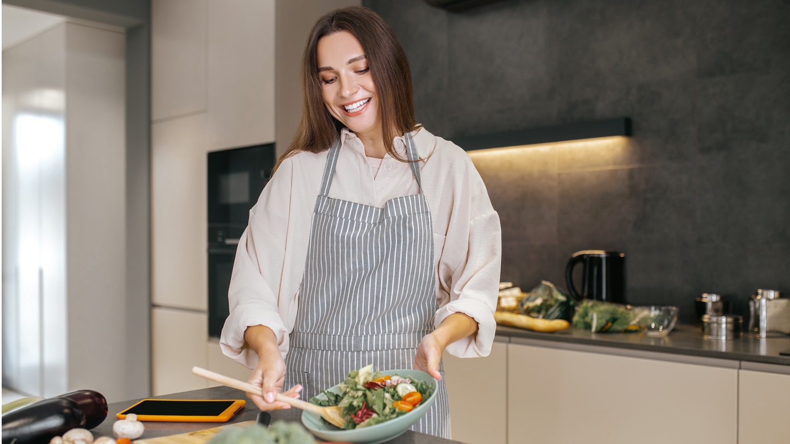 cute-positive-woman-in-the-kitchen-2021-12-17-06-03-18-utc