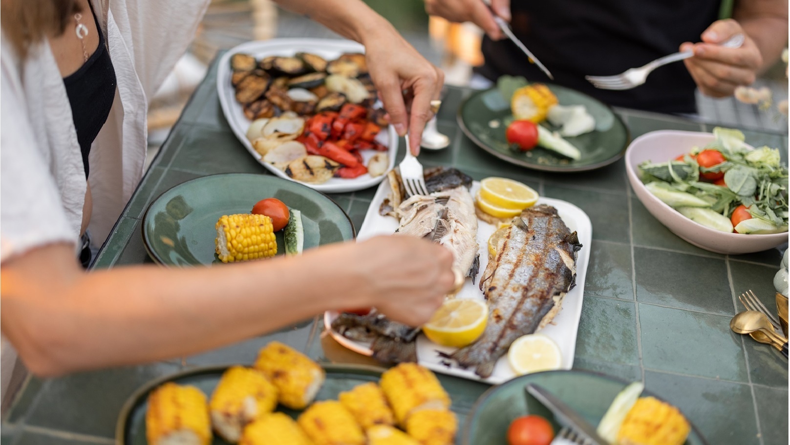 eating-grilled-fish-and-vegetables-close-up-2021-09-04-12-15-57-utc