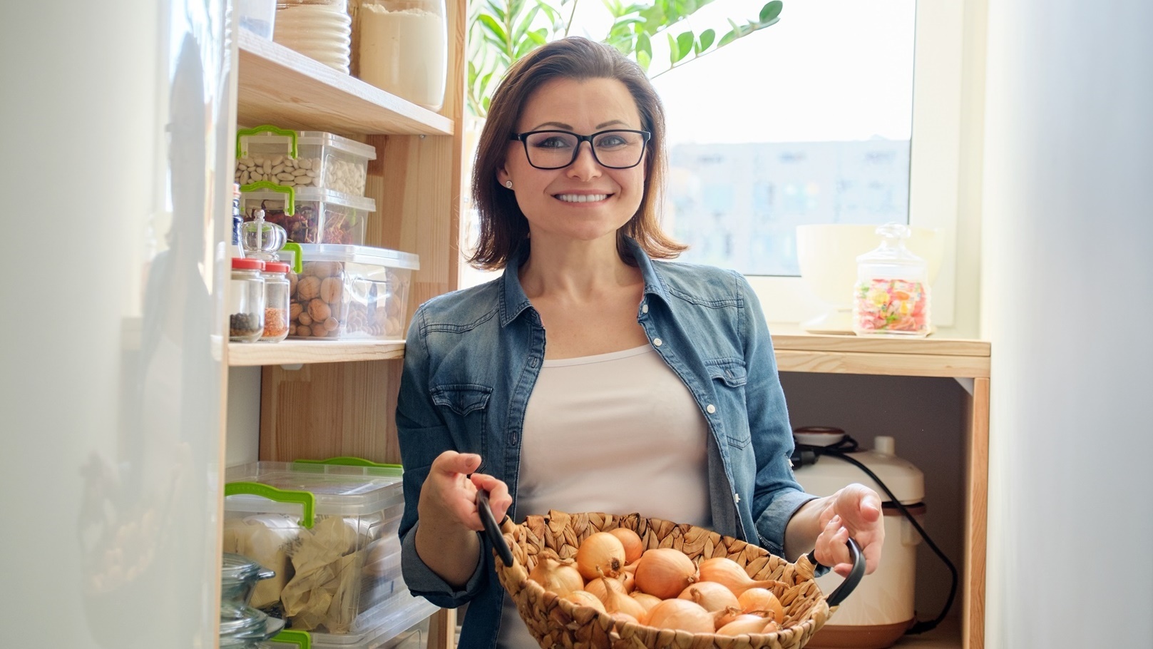 woman-in-pantry-taking-basket-with-onions-food-st-2022-01-13-23-36-05-utc