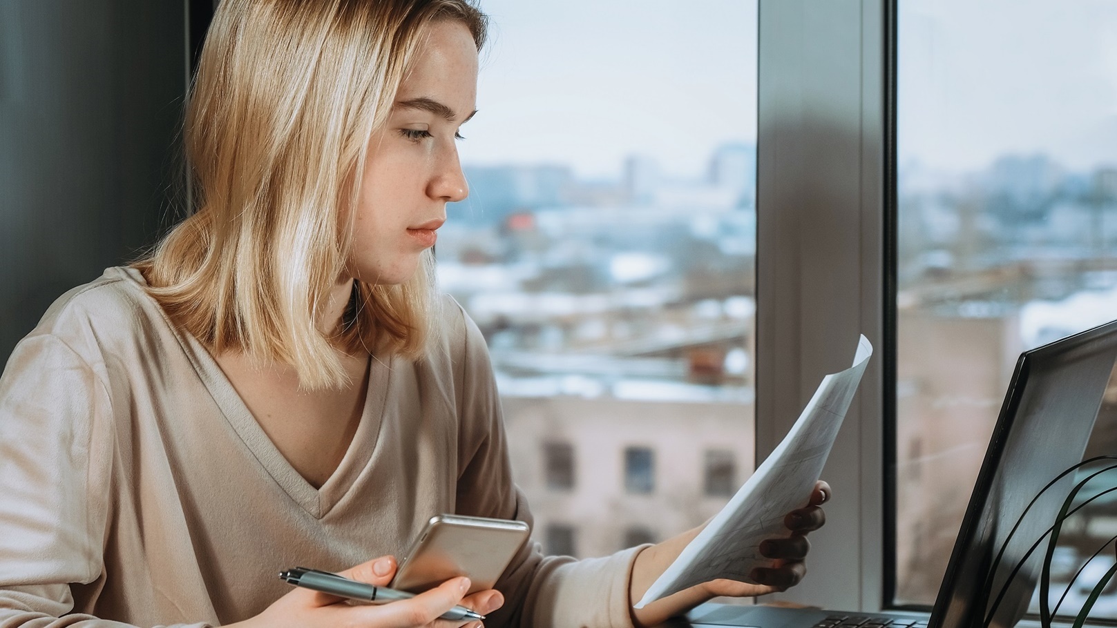 investments-young-woman-investor-buys-stocks-on-t-2022-01-12-05-19-47-utc