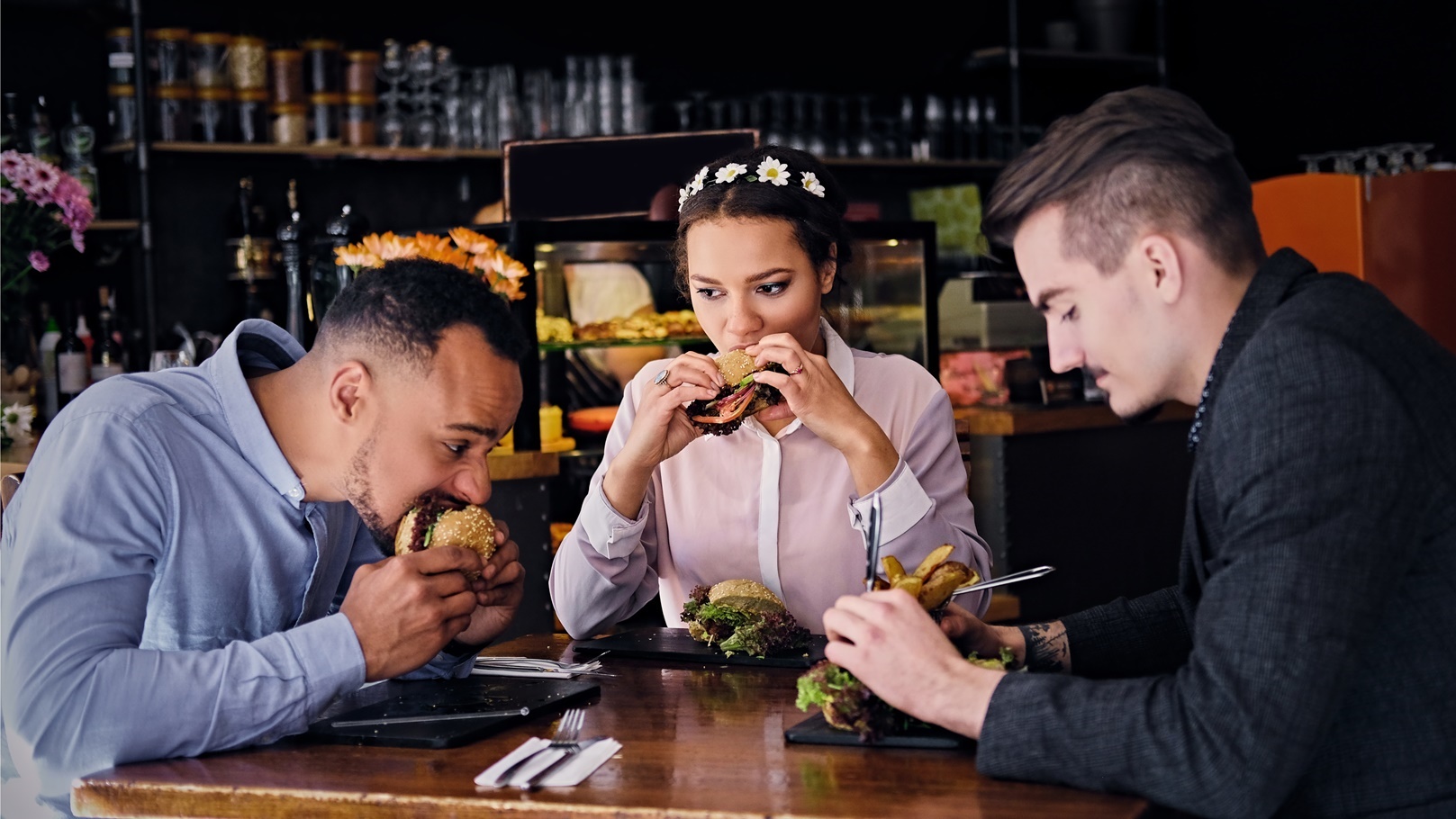 three-people-eats-sandwiches-2021-08-28-12-31-13-utc