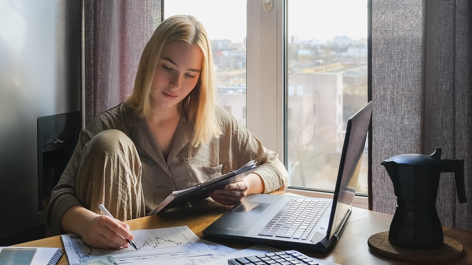 investments-young-woman-investor-buys-stocks-on-t-2021-12-09-09-32-58-utc