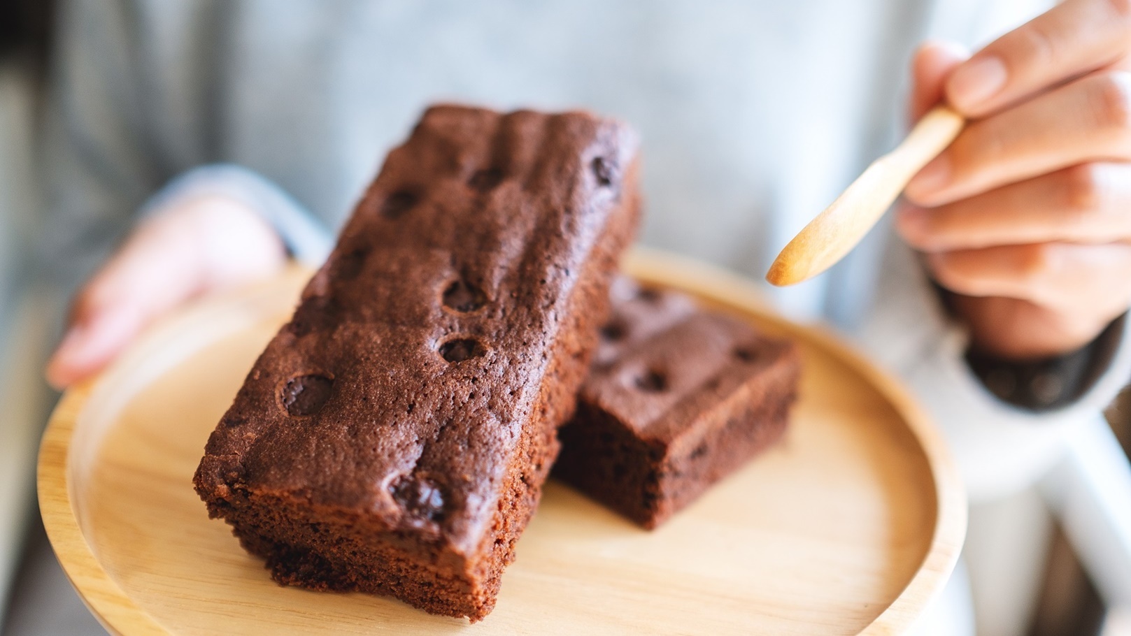 closeup-image-of-a-woman-eating-delicious-brownie-2021-10-21-03-34-57-utc