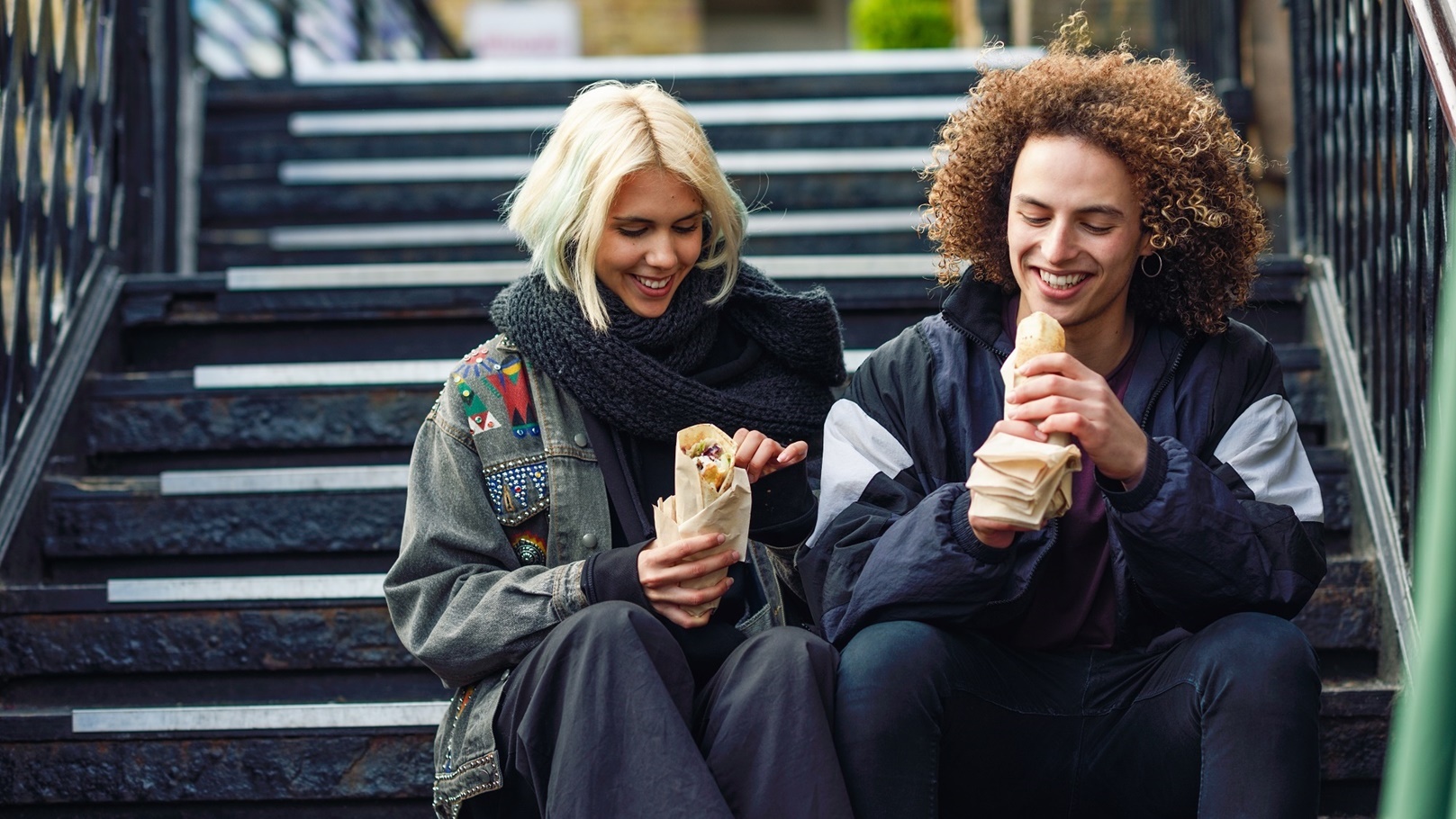 happy-couple-eating-doner-kebab-shawarma-in-camd-2021-08-26-20-00-25-utc