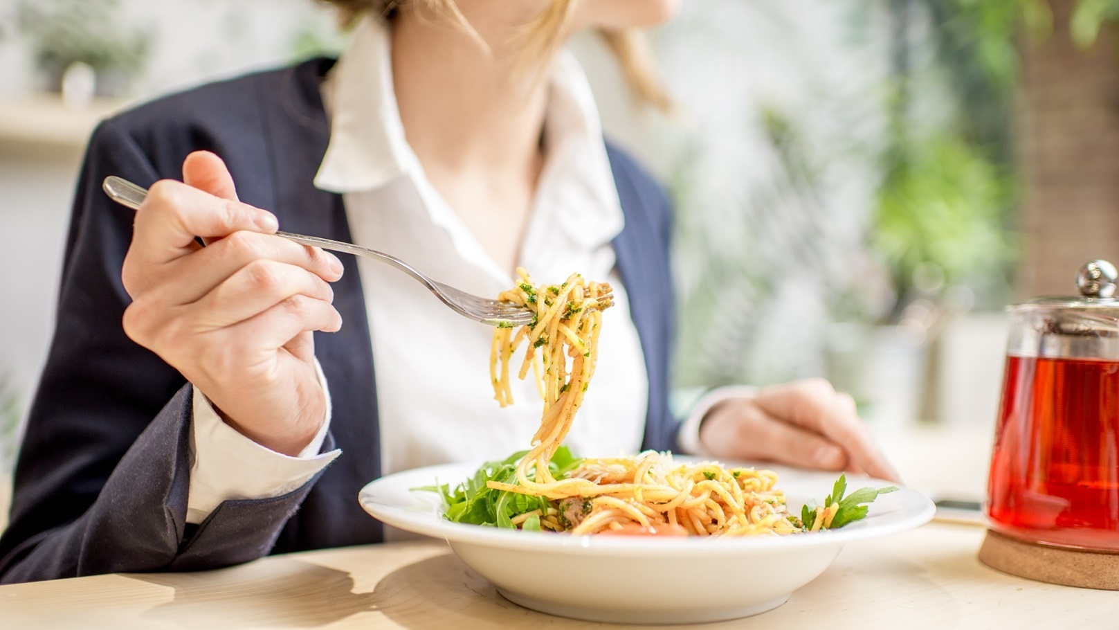 businesswoman-eating-pasta-at-the-restaurant-2021-12-23-15-27-21-utc