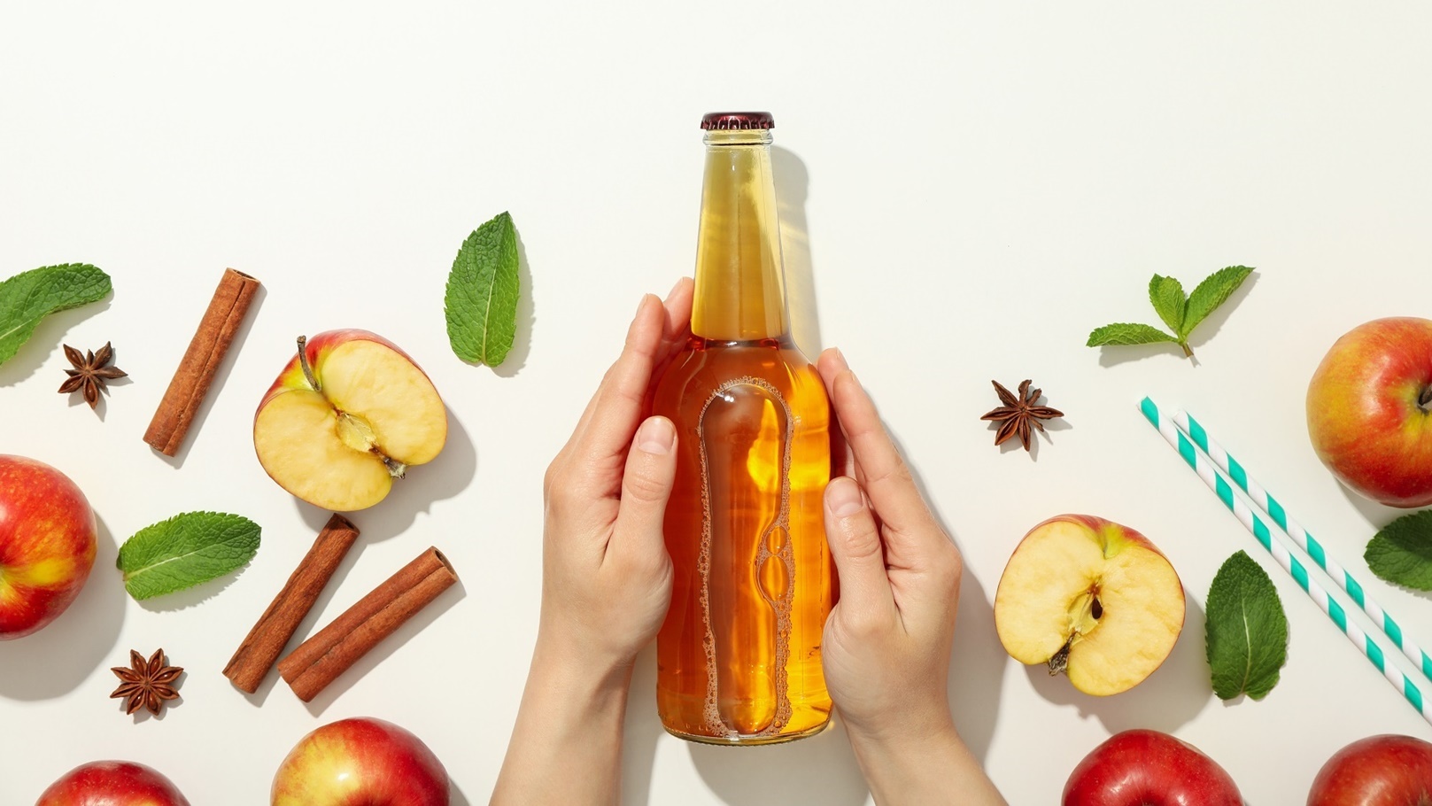 female-hands-hold-bottle-of-cider-on-white-backgro-2021-09-02-21-29-13-utc
