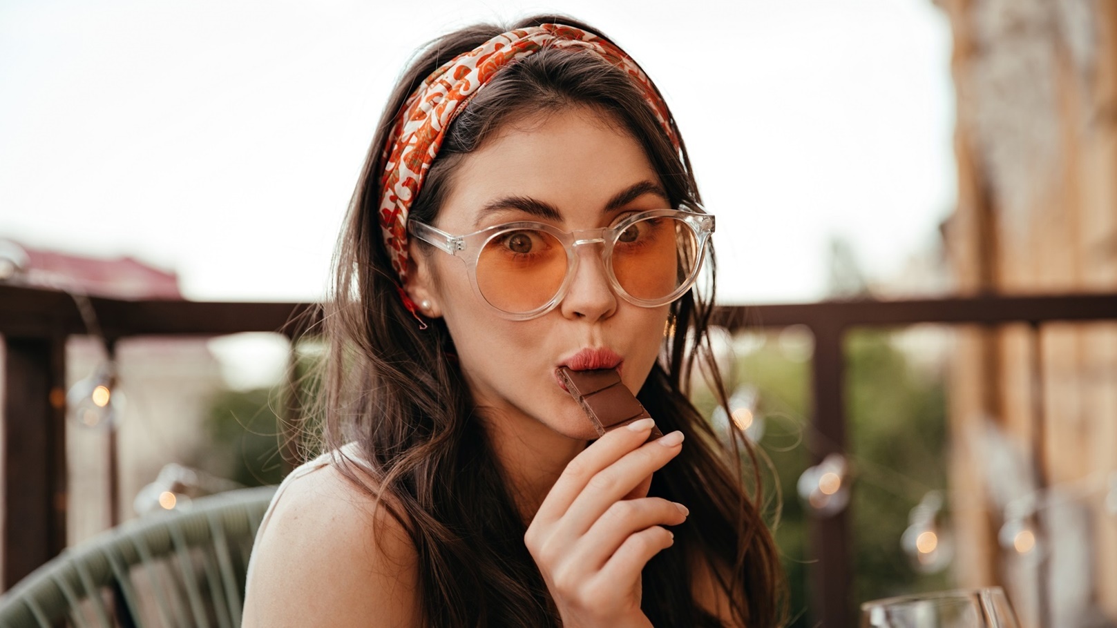 surprised-lady-in-sunglasses-eats-milk-chocolate-a-2021-09-02-23-52-28-utc