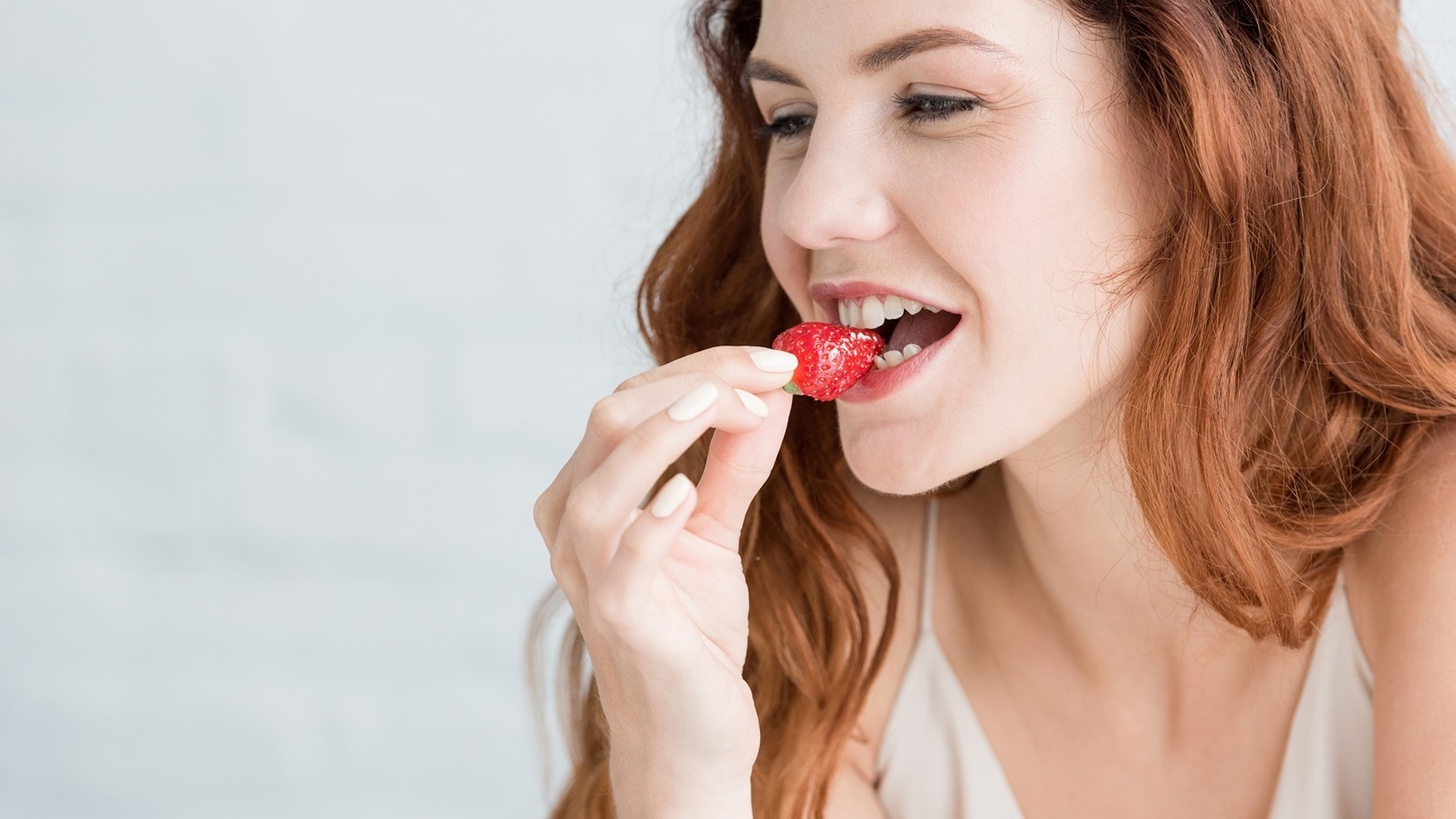 close-up-portrait-of-beautiful-young-woman-eating-2021-10-07-17-25-18-utc
