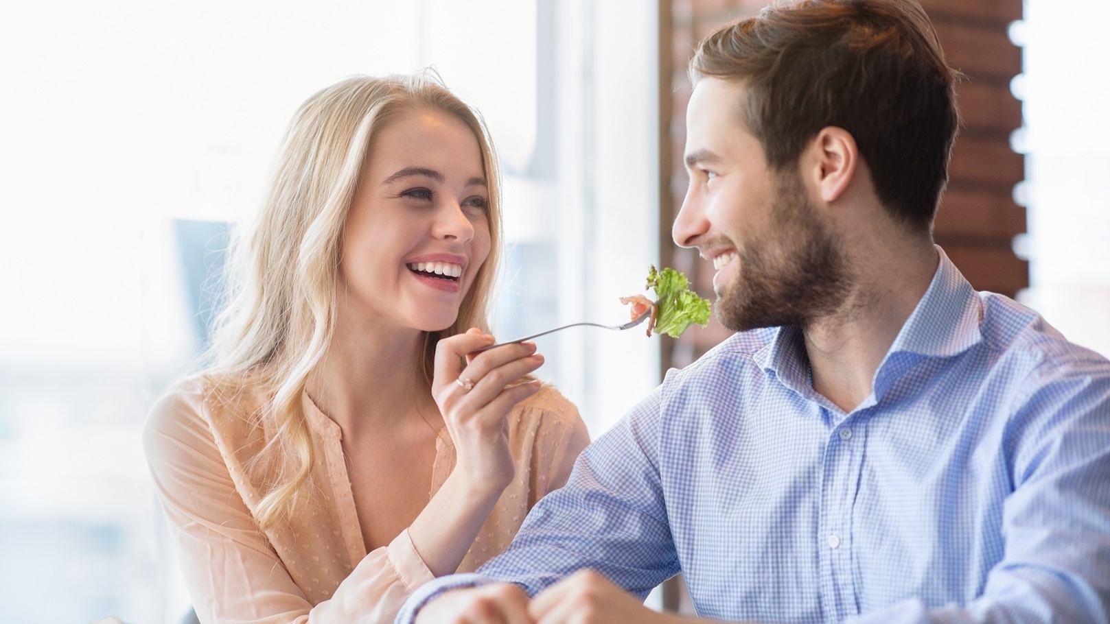 cheerful-millennial-couple-eating-together-at-coff-2021-09-02-23-52-09-utc
