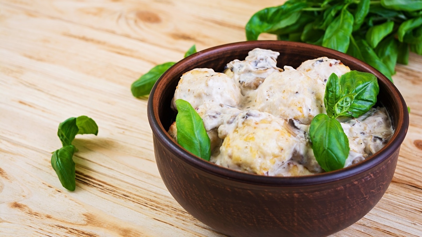 meatballs-with-cream-and-mushrooms-on-wooden-backg-2021-10-28-00-58-39-utc