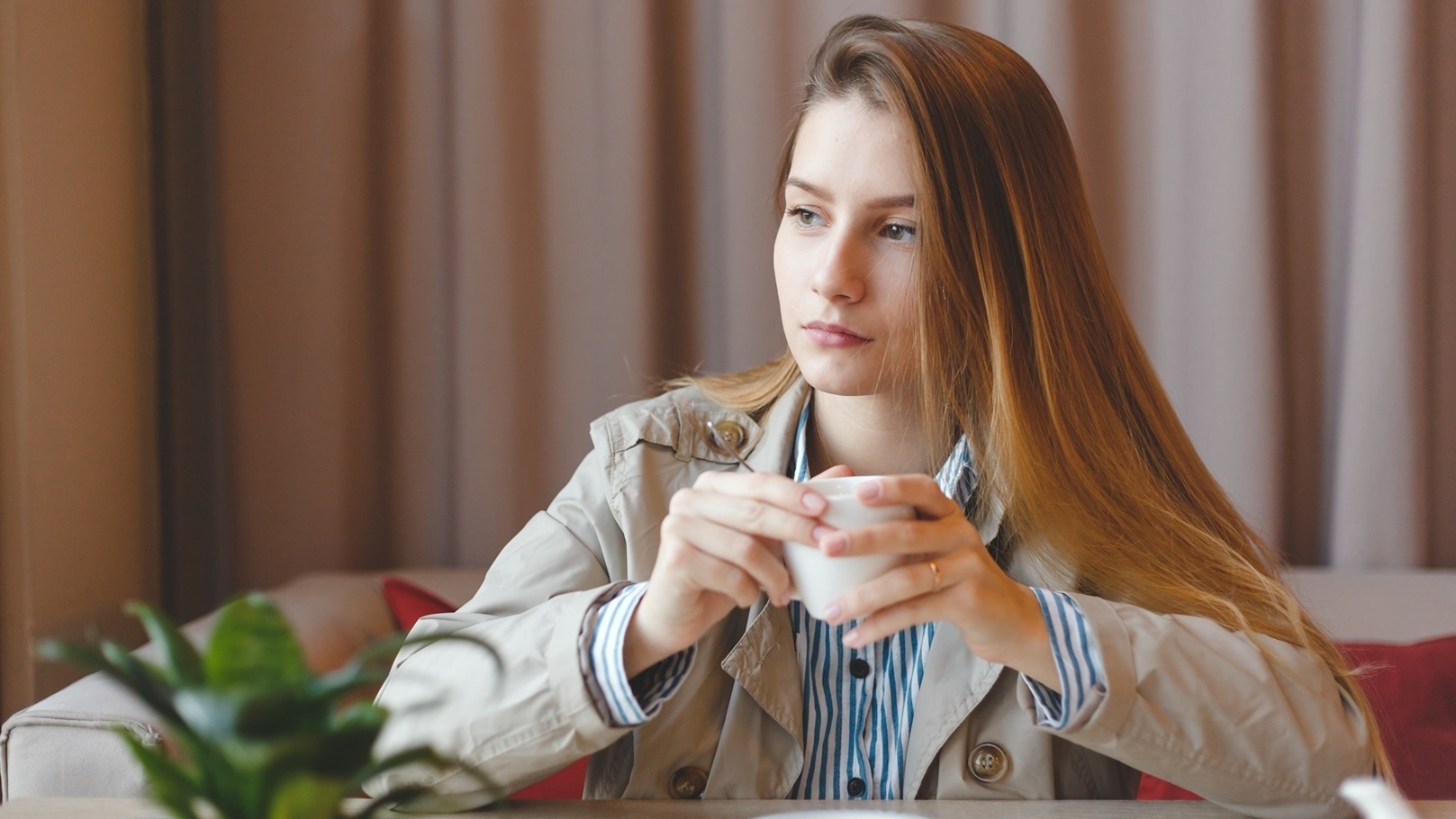 woman-drinking-tea-in-the-morning-at-restaurant-2022-03-30-20-23-47-utc