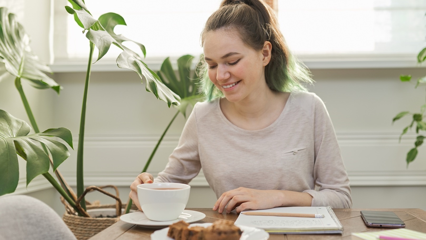 teen-girl-eating-cupcakes-drinking-tea-sitting-a-2022-01-13-23-30-29-utc